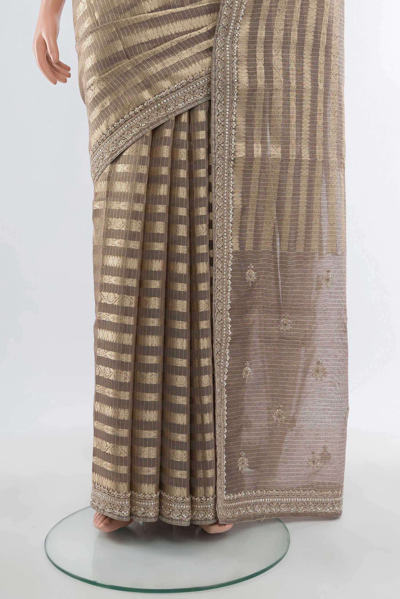 Pleats and pallu of Golden Art Silk Saree with Stripes on the body and Embroidery Border. 