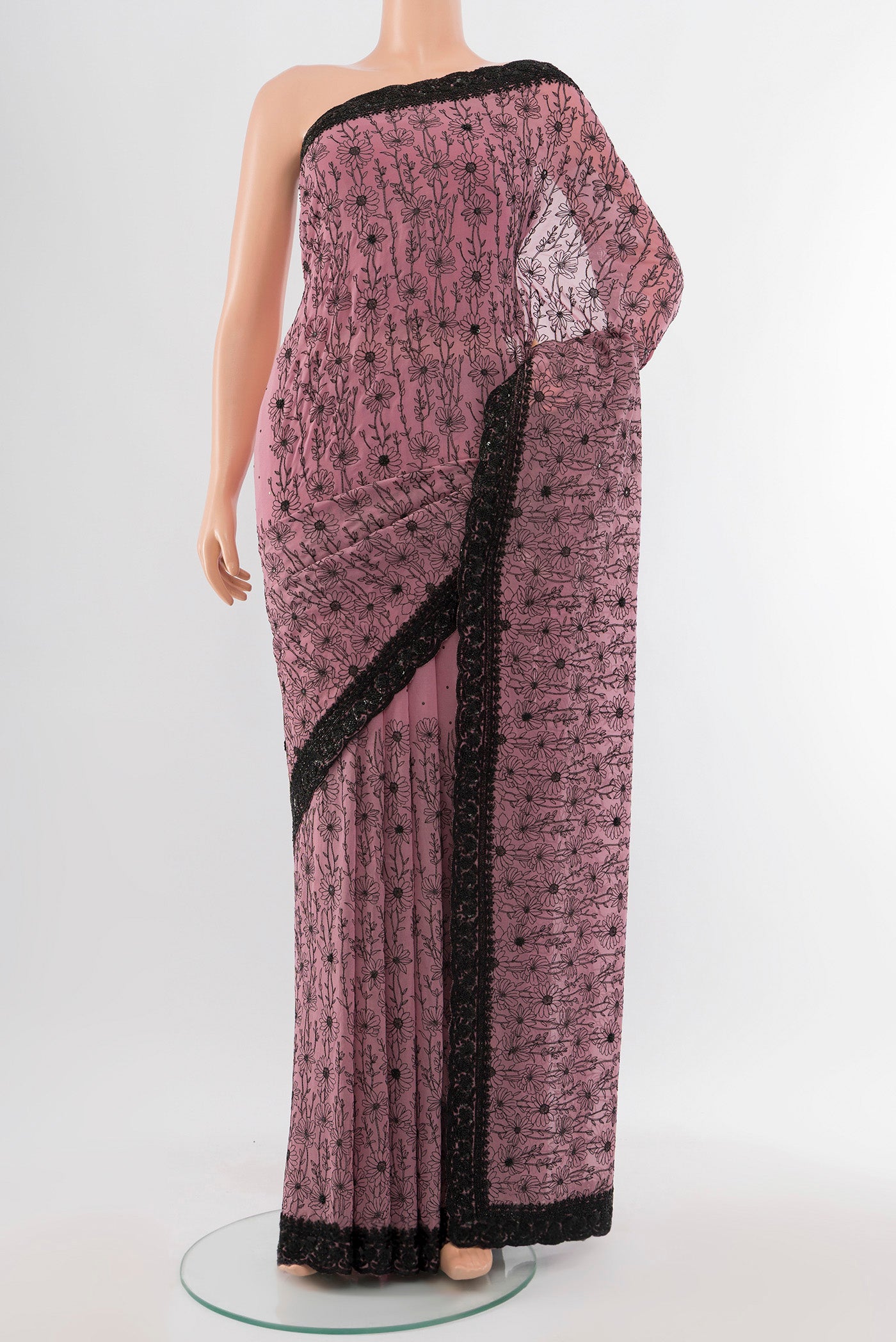 Teal Embroidery Net Saree with Embroidery on the body and Silk Border.  displayed on a mannequin