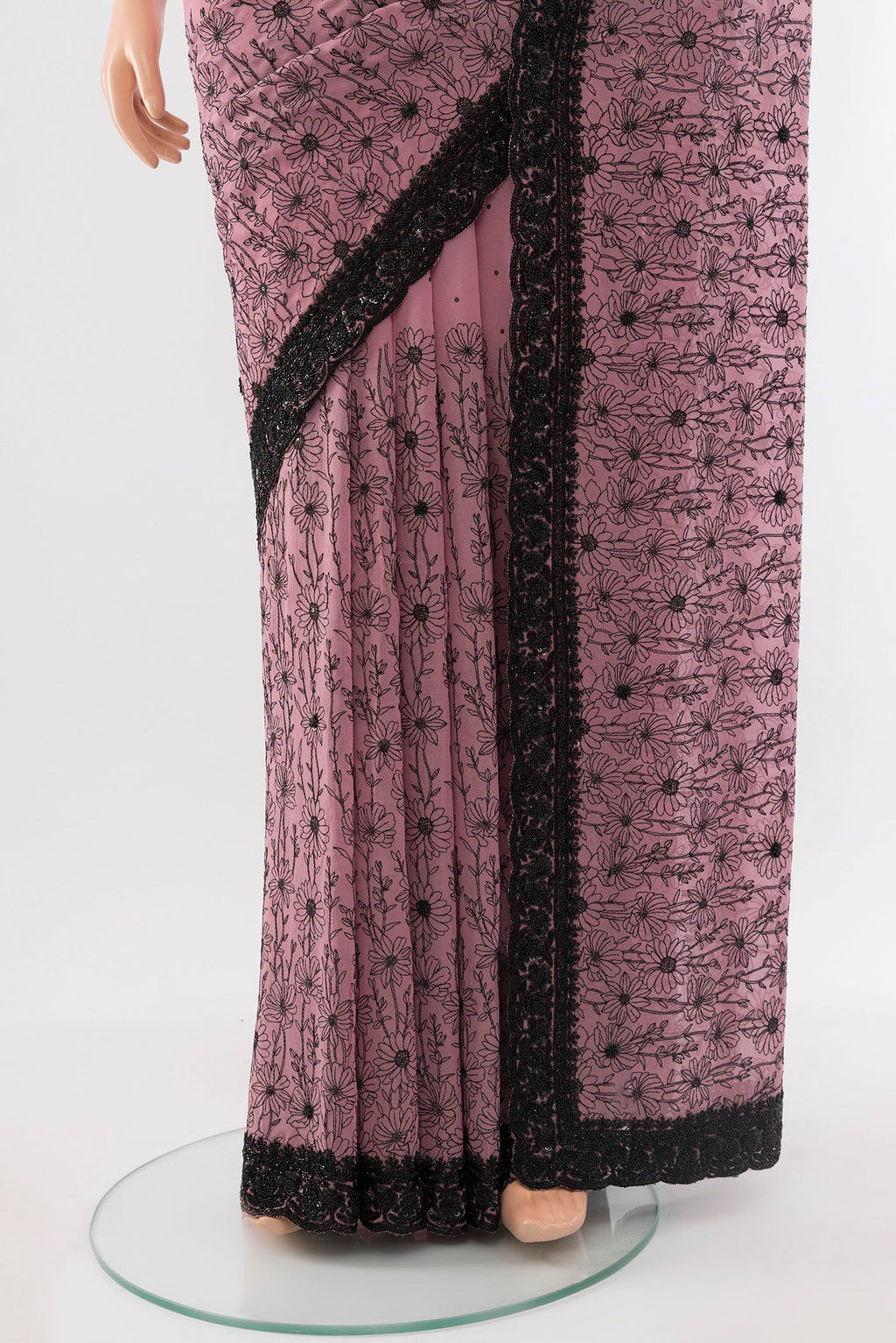 Pleats and pallu of Teal Embroidery Net Saree with Embroidery on the body and Silk Border. 
