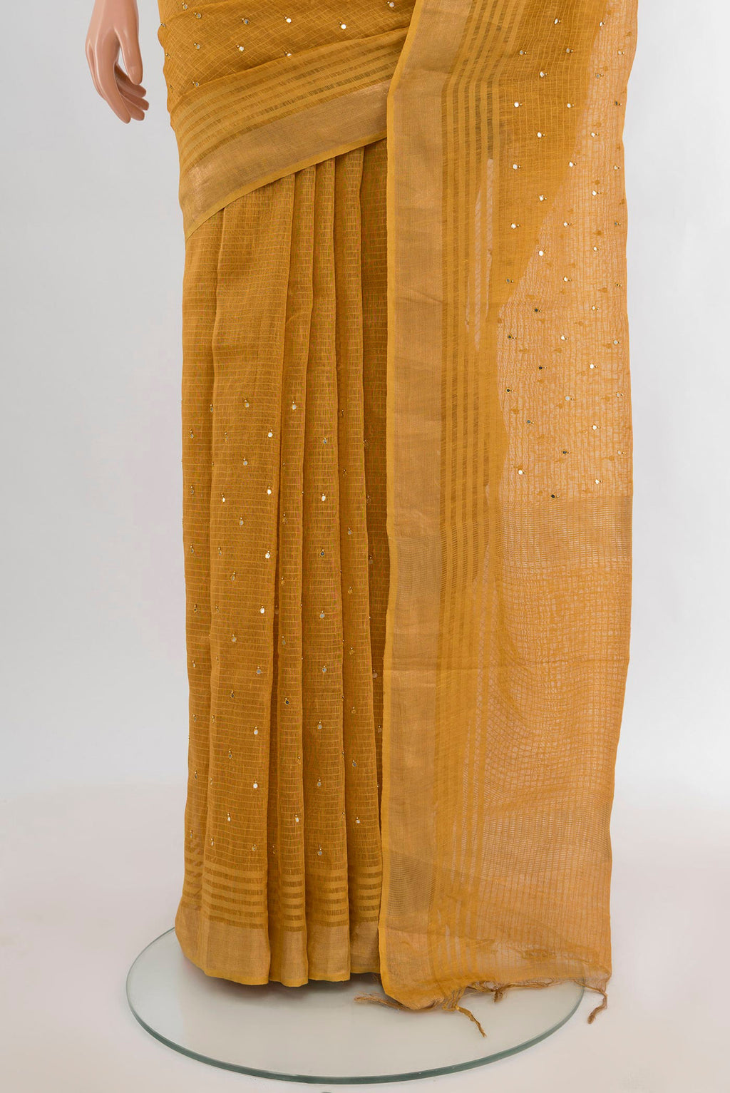 Pleats and pallu of Mustard Tussar Silk Saree with Embroidery on the body and Zari Border. 
