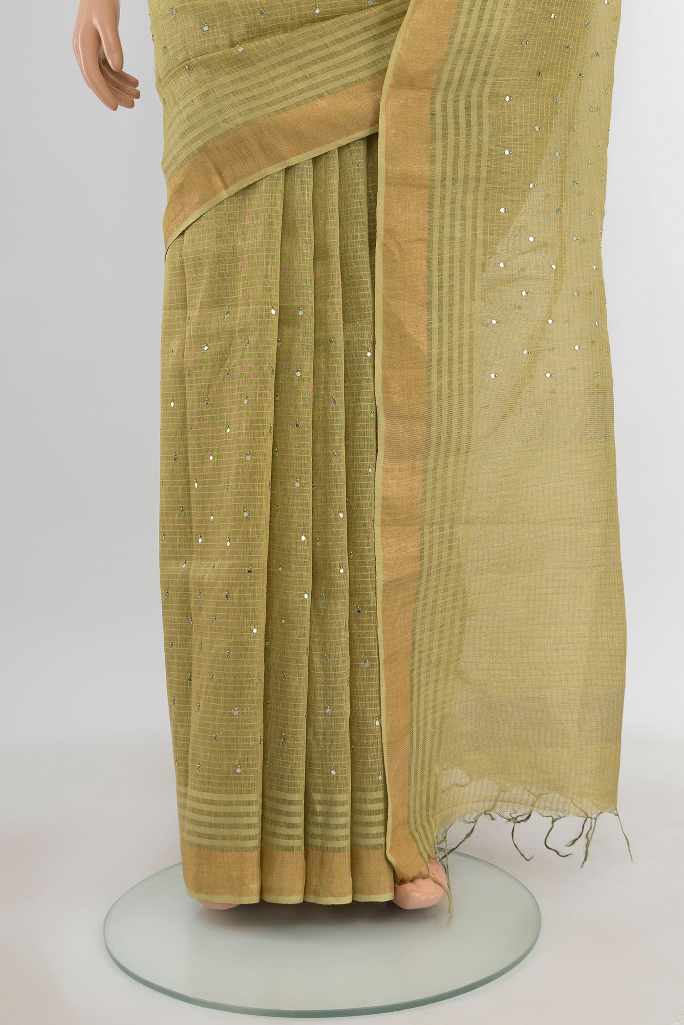 Pleats and pallu of Light Green Tussar Silk Saree with Embroidery on the body and Silk Border. 