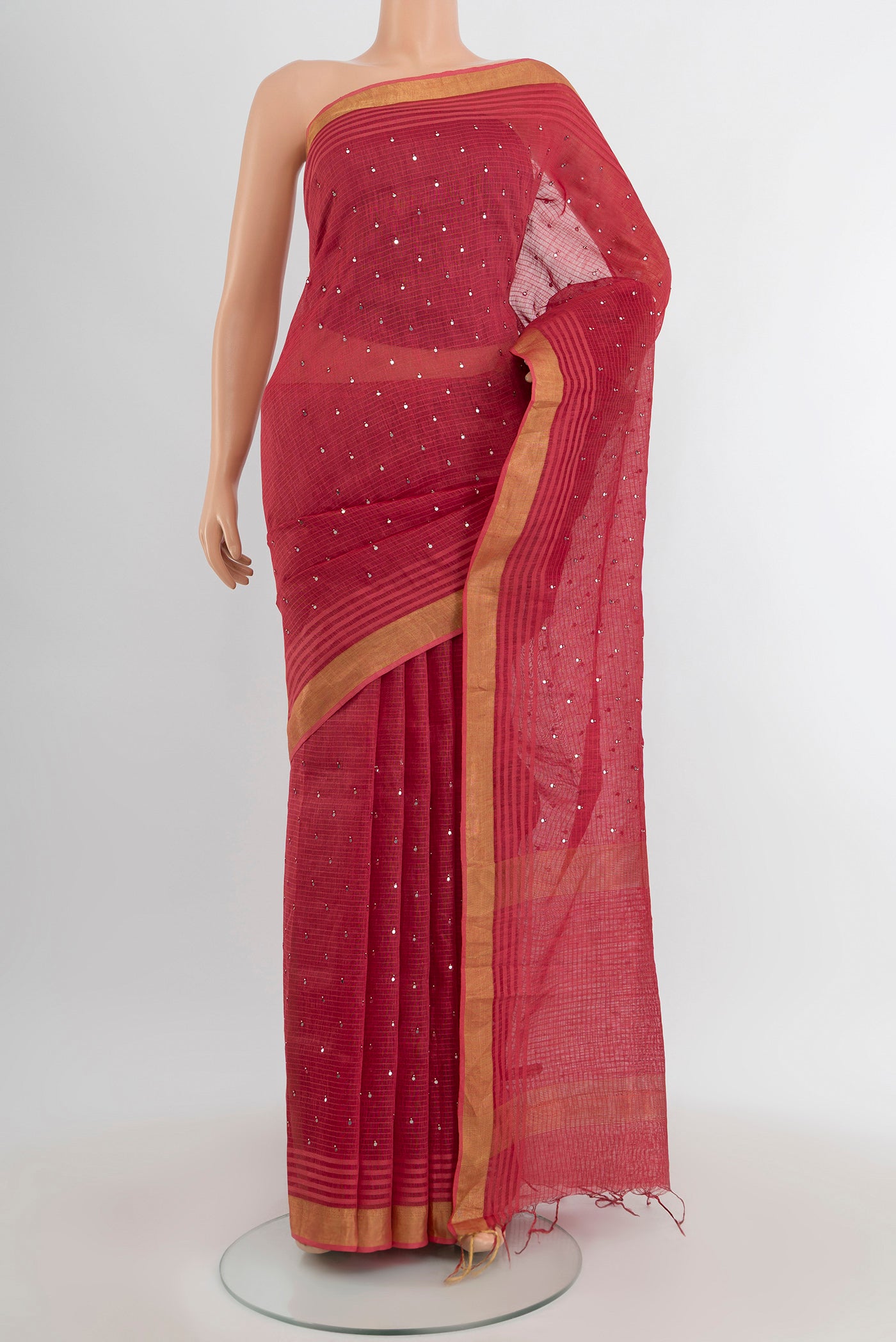 Bronze Tussar Silk Saree with Embroidery on the body and Silk Border.  displayed on a mannequin