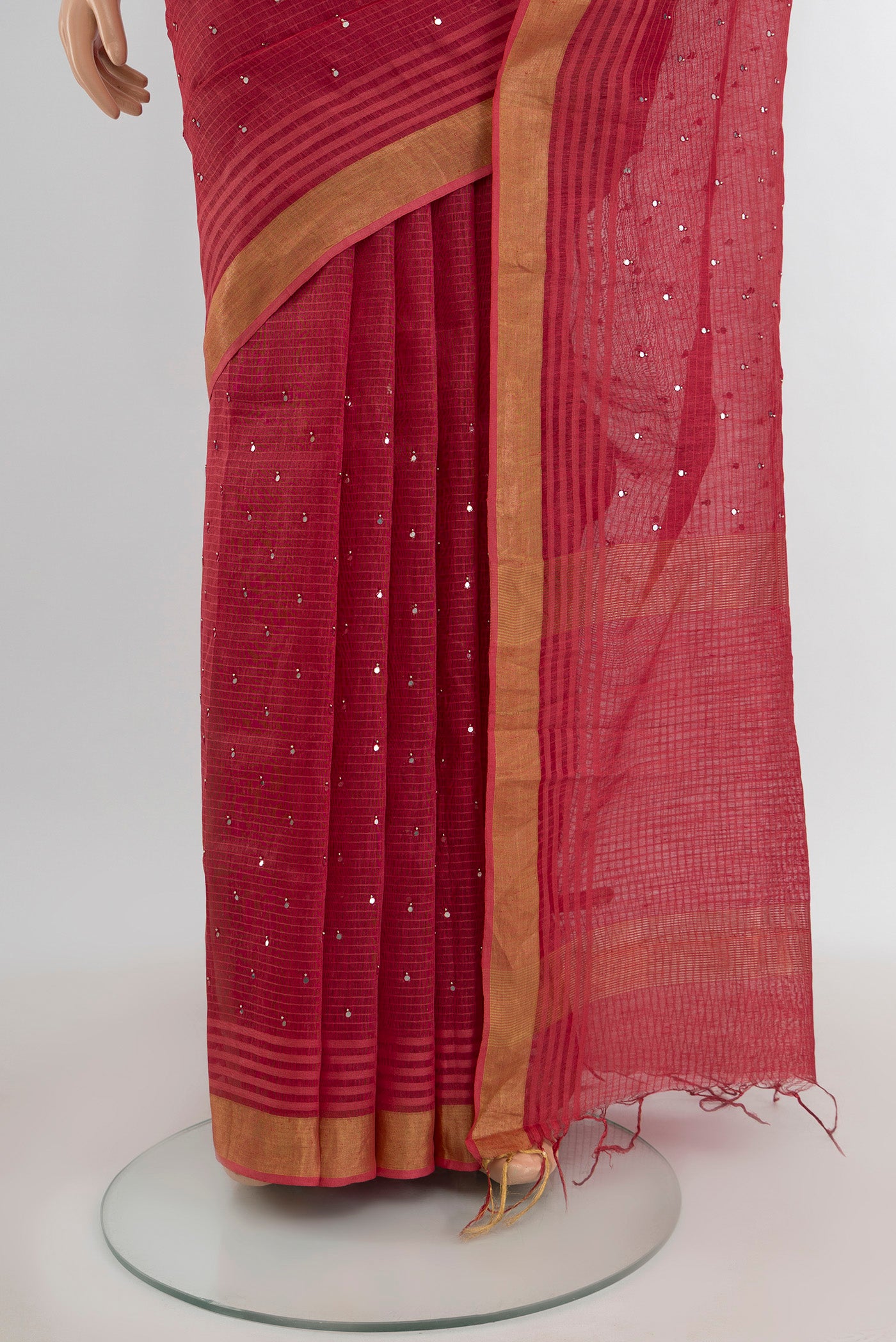 Pleats and pallu of Bronze Tussar Silk Saree with Embroidery on the body and Silk Border. 