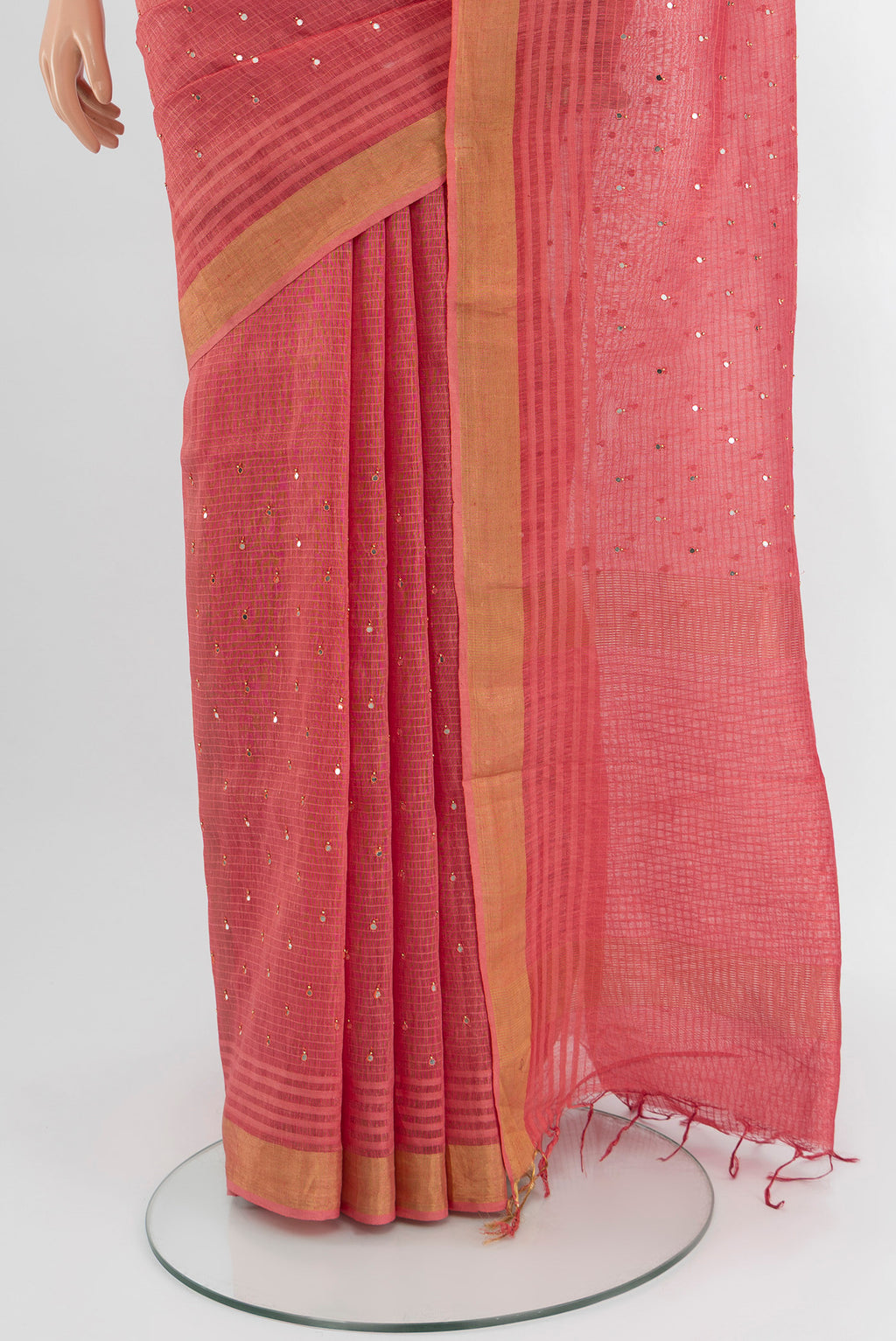 Pleats and pallu of Pink Tussar Silk Saree with Embroidery on the body and Zari Border. 