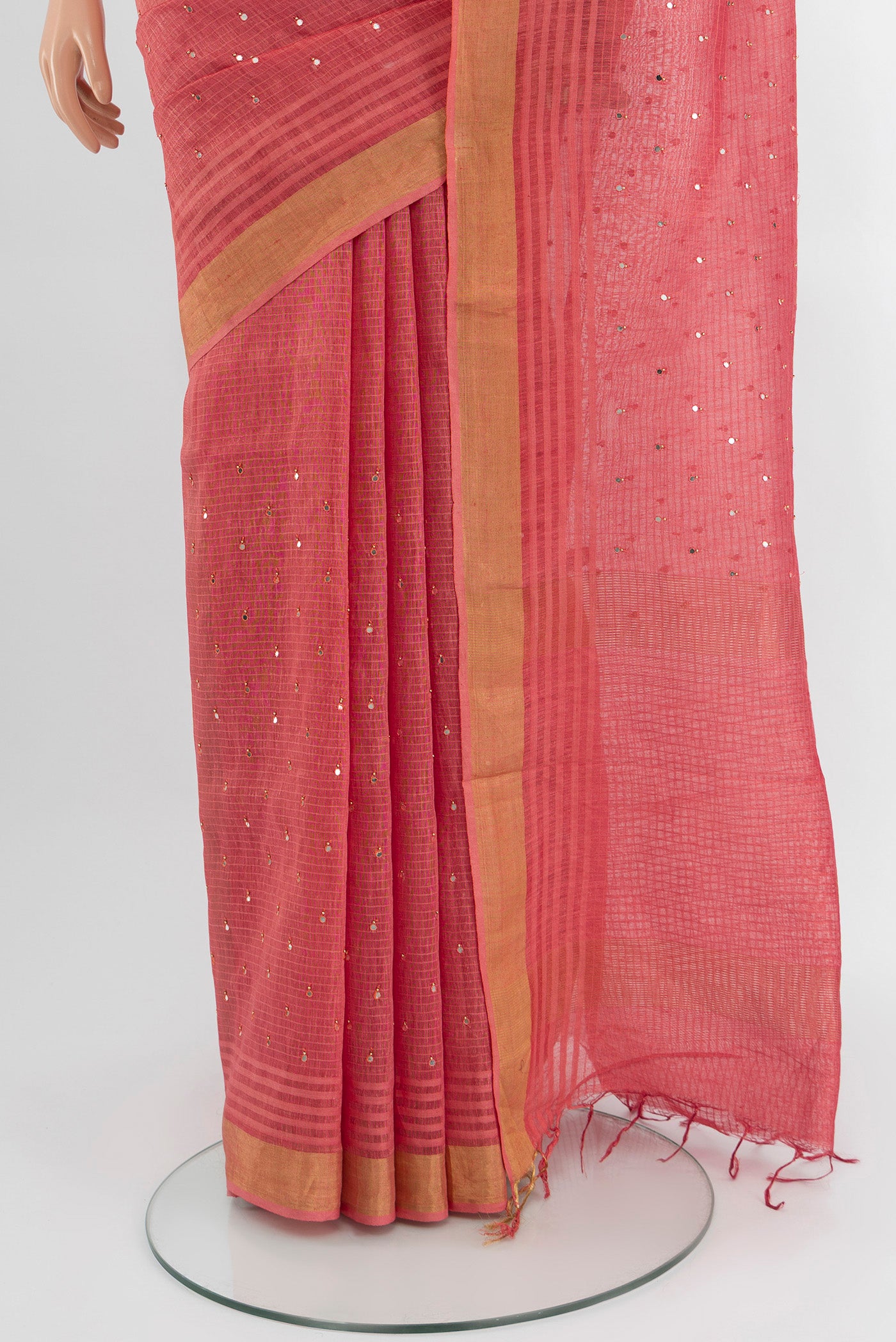Pleats and pallu of Pink Tussar Silk Saree with Embroidery on the body and Zari Border. 