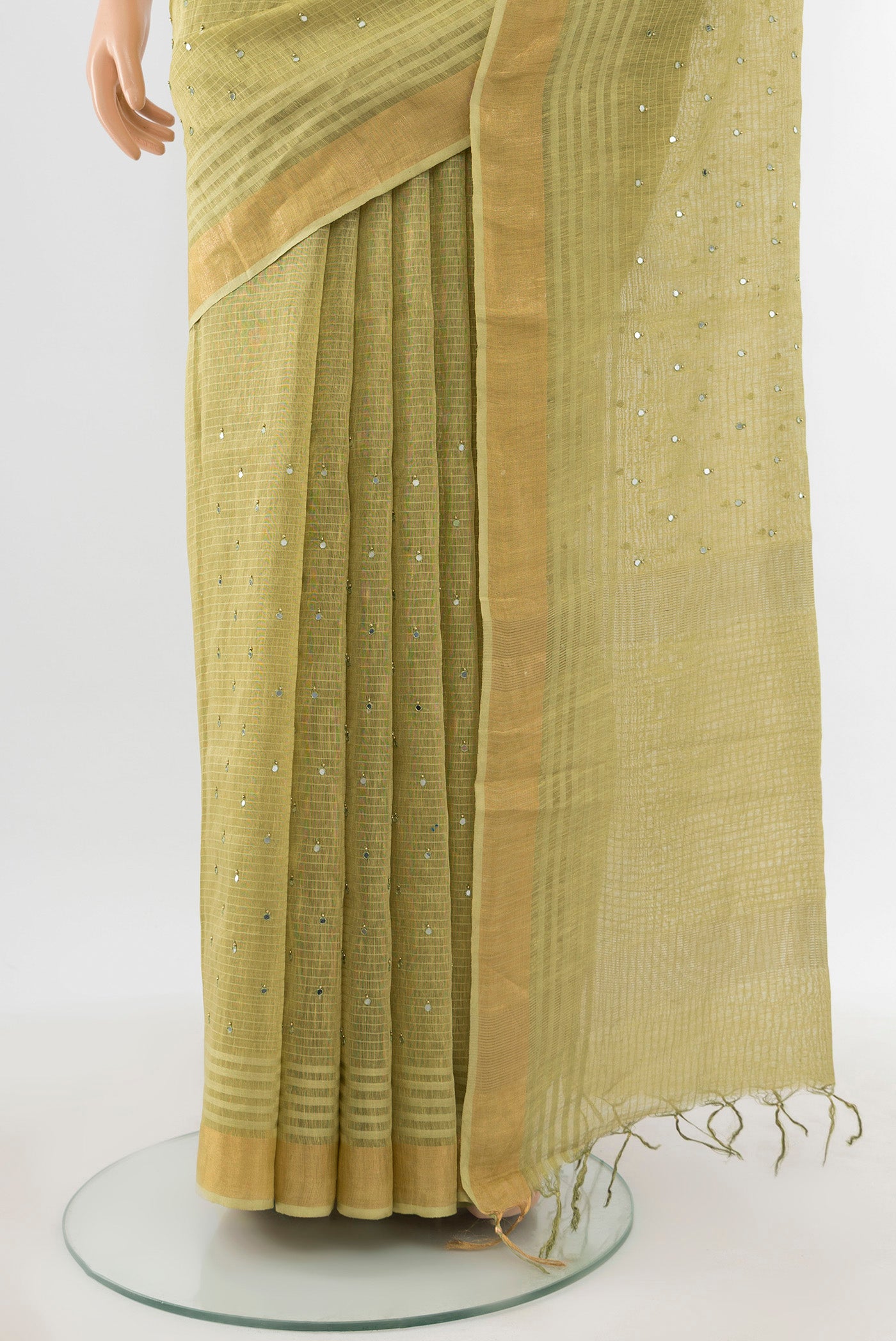 Pleats and pallu of Light Green Tussar Silk Saree with Embroidery on the body and Silk Border. 