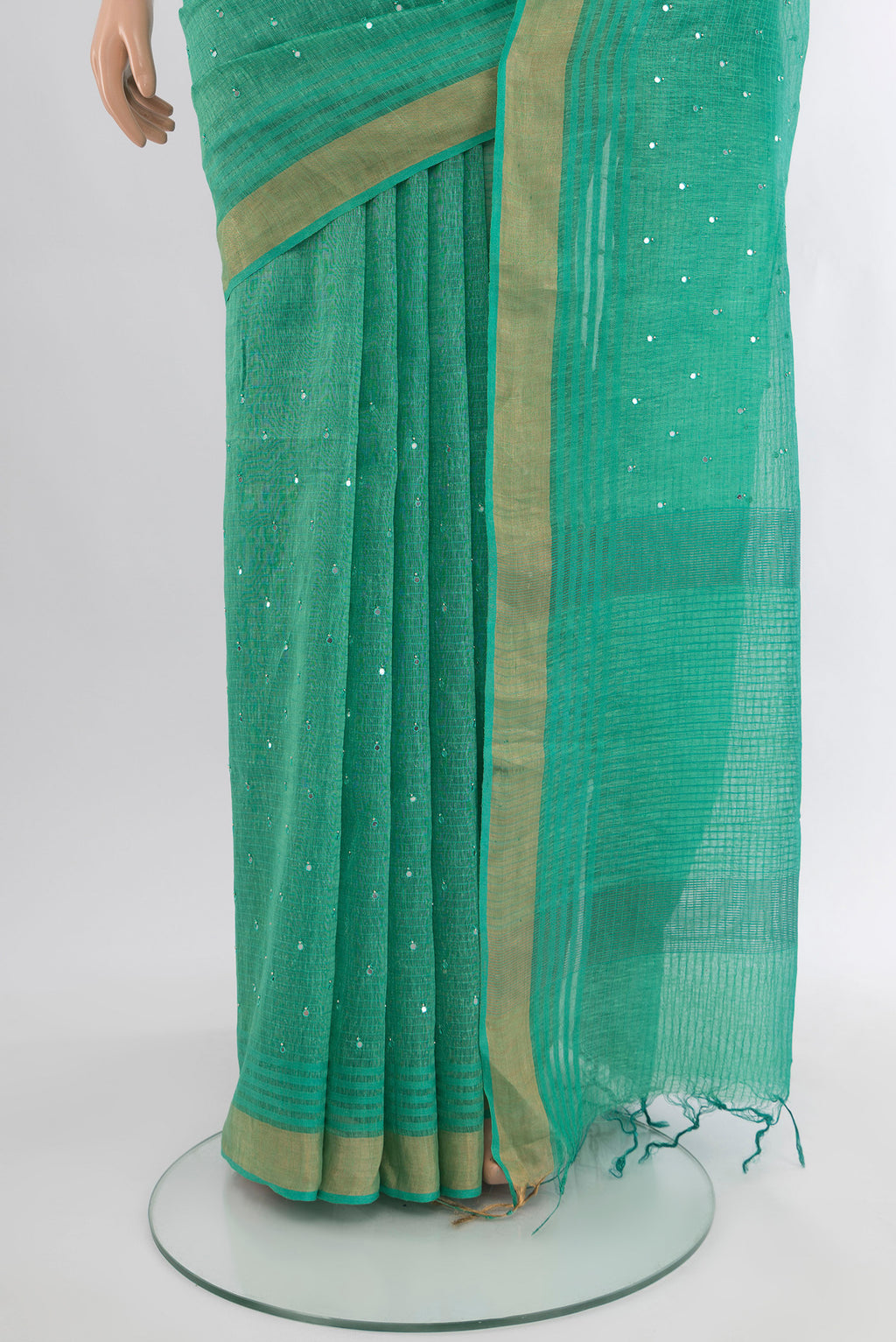 Pleats and pallu of Sea Green Tussar Silk Saree with Embroidery on the body and Zari Border. 