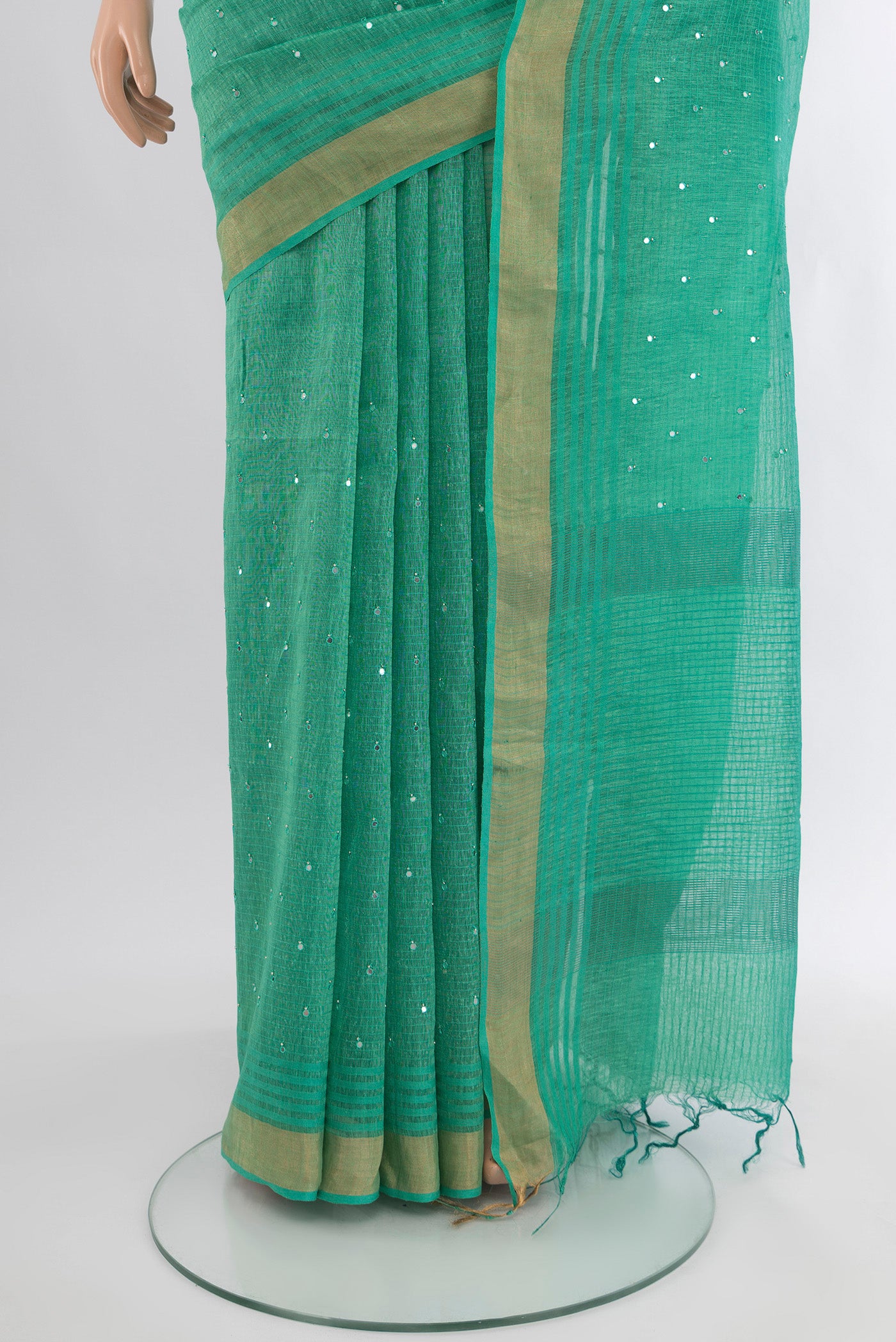 Pleats and pallu of Sea Green Tussar Silk Saree with Embroidery on the body and Zari Border. 