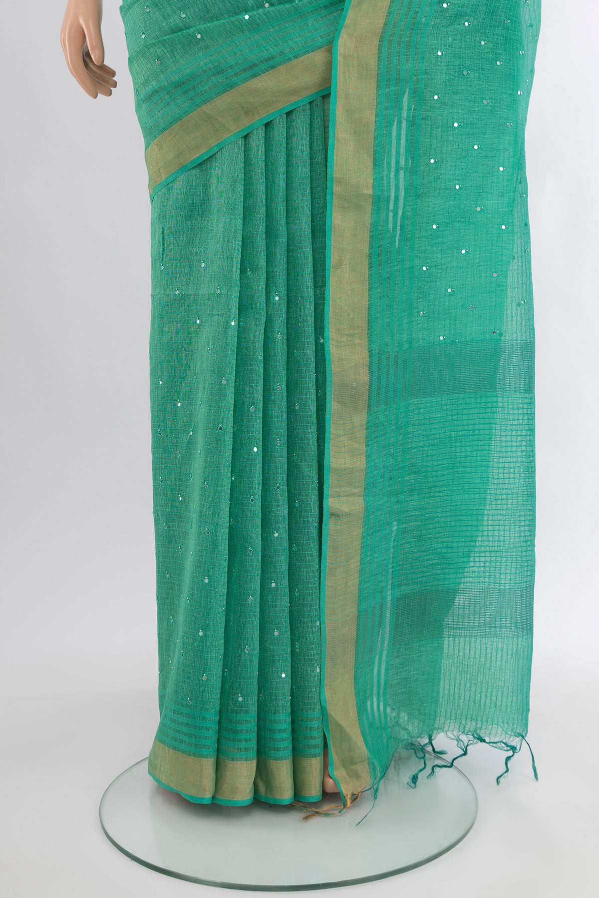 Pleats and pallu of Sea Green Tussar Silk Saree with Embroidery on the body and Zari Border. 