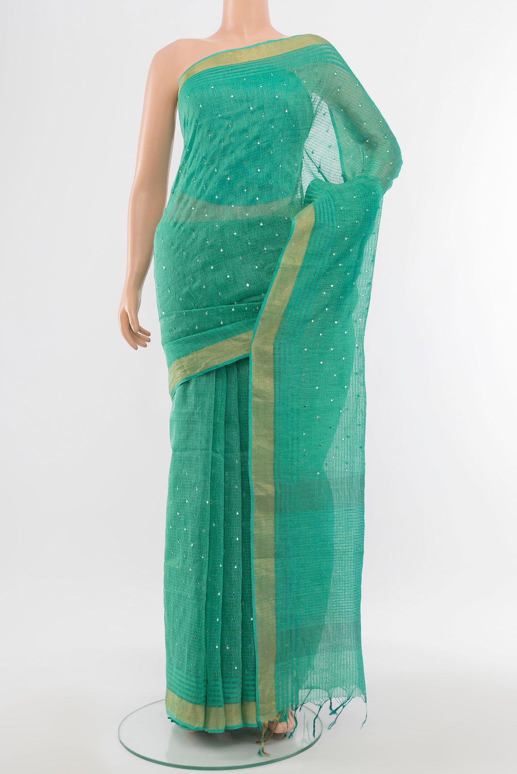 Sky Blue Tussar Silk Saree with Embroidery on the body and Silk Border.  displayed on a mannequin