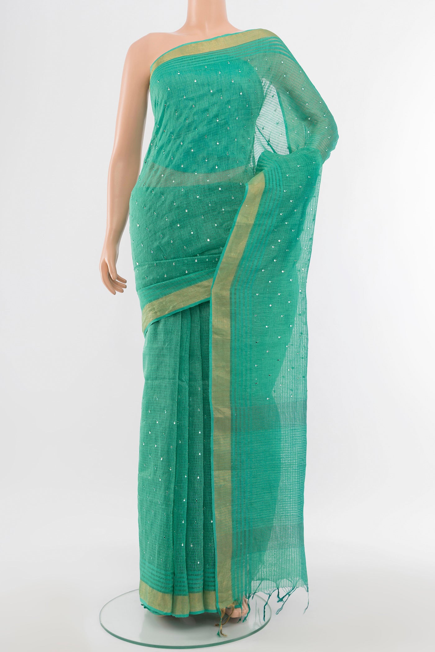 Sky Blue Tussar Silk Saree with Embroidery on the body and Silk Border.  displayed on a mannequin