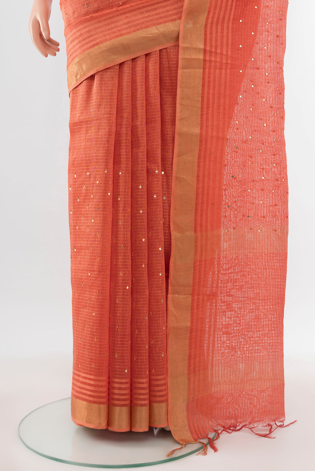 Pleats and pallu of Peach Tussar Silk Saree with Embroidery on the body and Silk Border. 