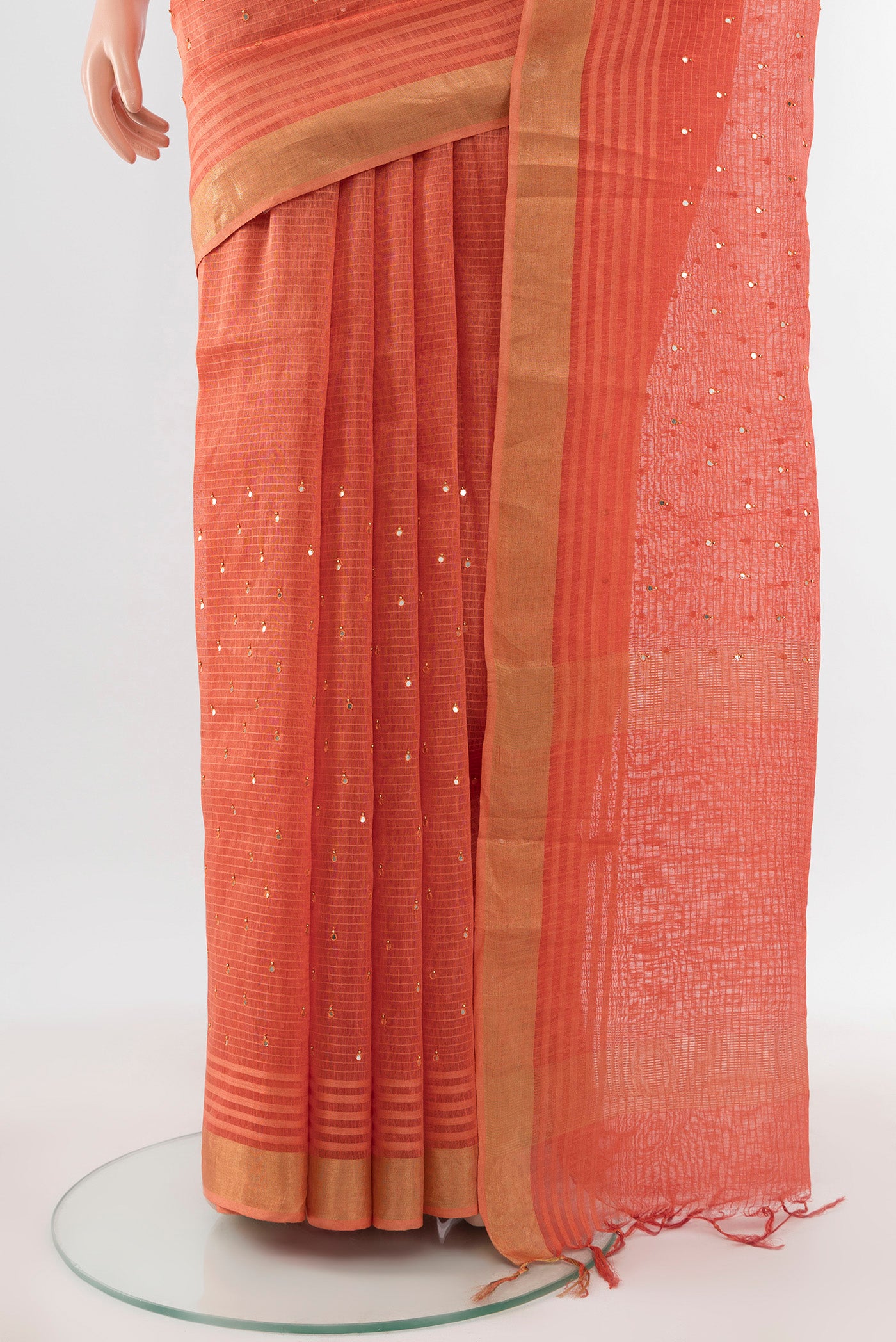 Pleats and pallu of Peach Tussar Silk Saree with Embroidery on the body and Silk Border. 