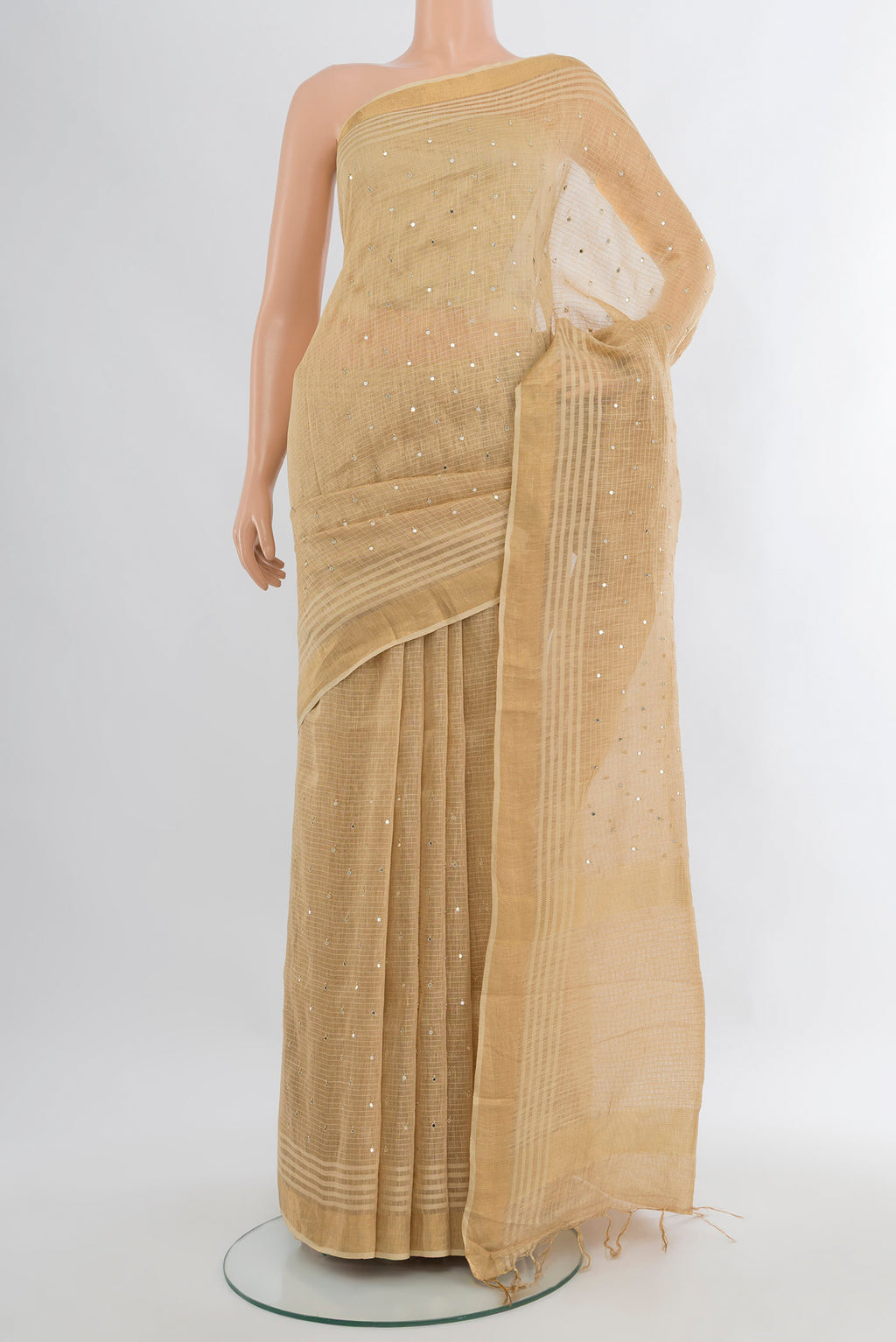 Sandal Tussar Silk Saree with Embroidery on the body and Zari Border.  displayed on a mannequin