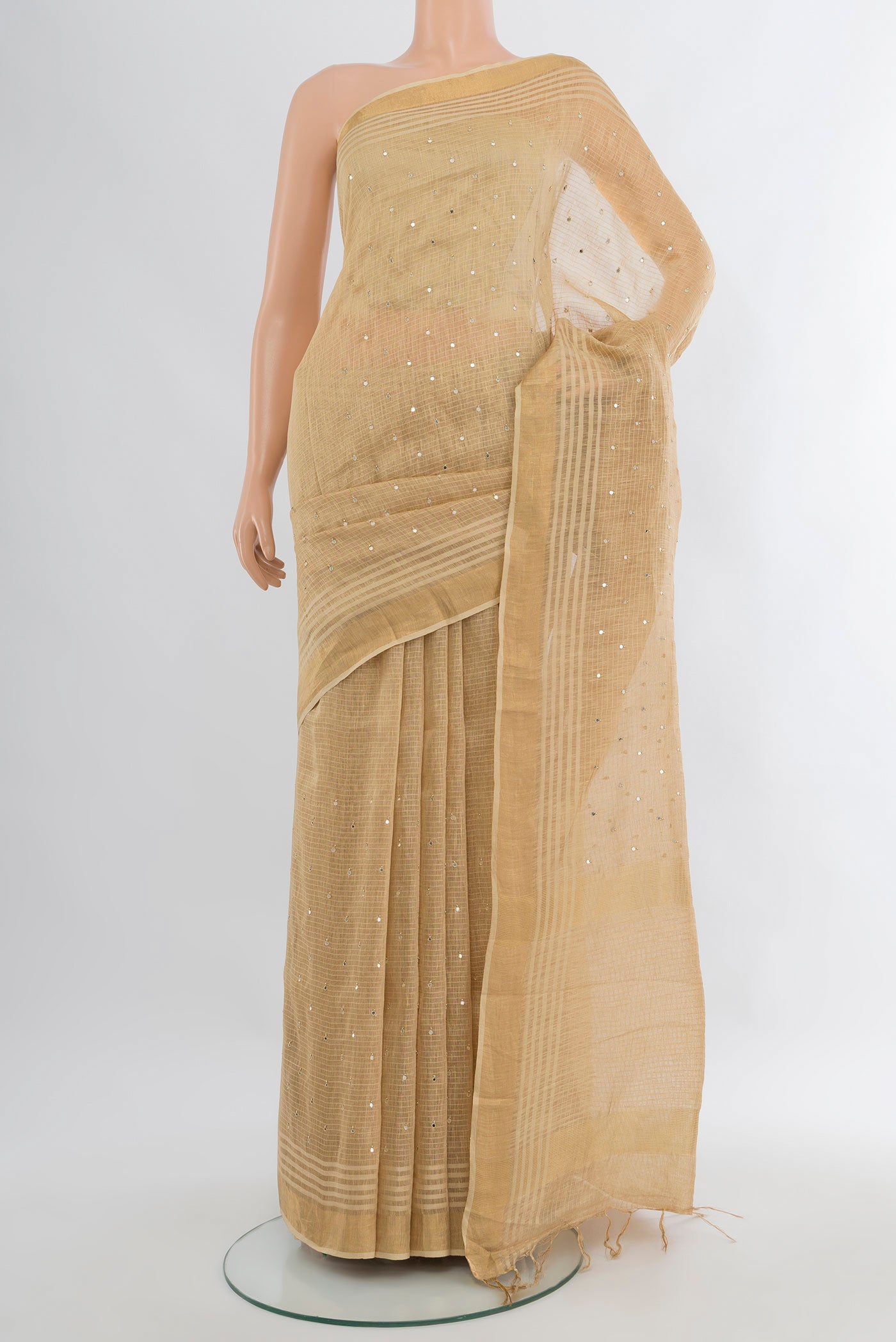 Sandal Tussar Silk Saree with Embroidery on the body and Zari Border.  displayed on a mannequin