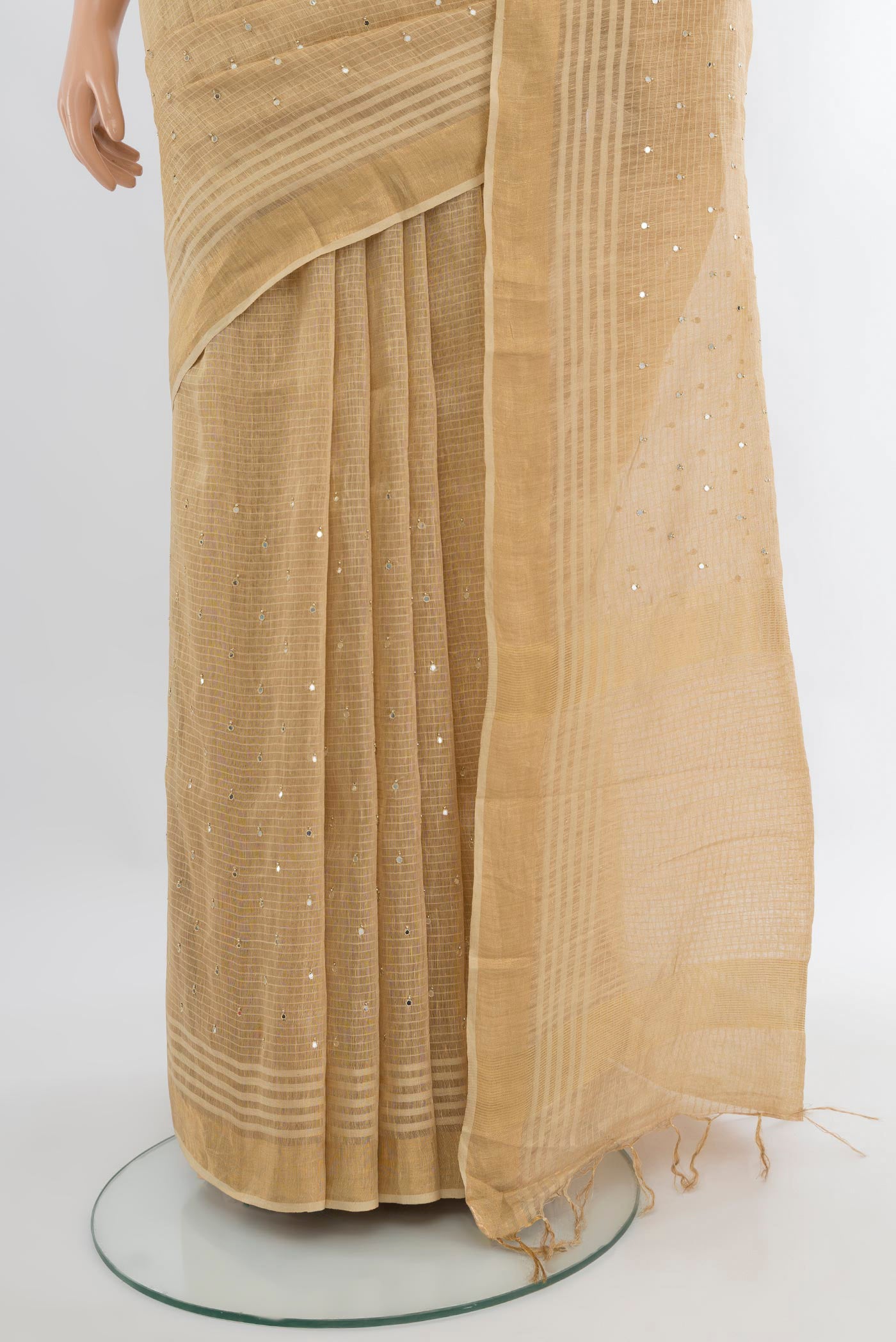 Pleats and pallu of Sandal Tussar Silk Saree with Embroidery on the body and Zari Border. 