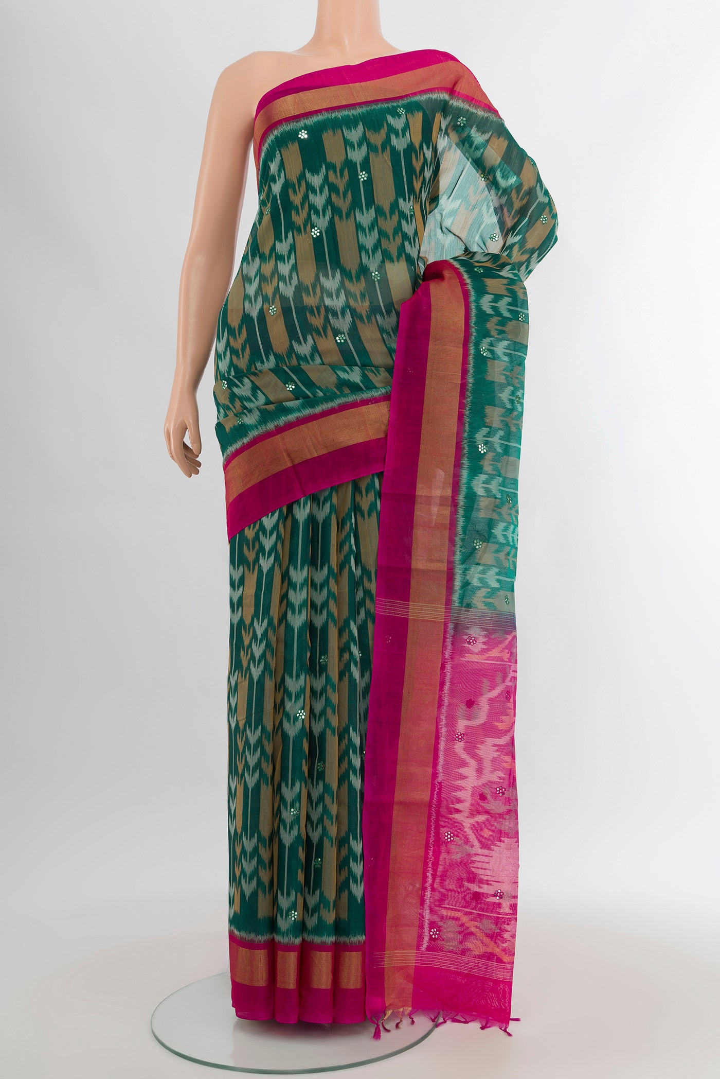 Teal Silk Cotton Saree with Ikat Print on the body and Zari Border.  displayed on a mannequin