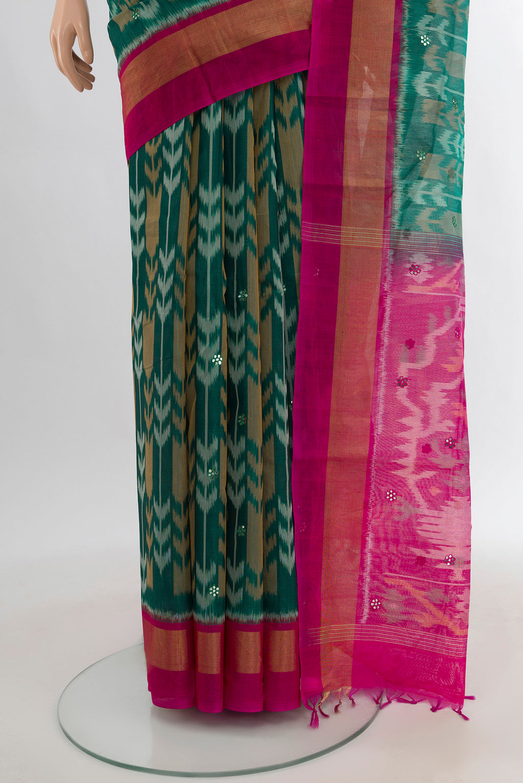 Pleats and pallu of Teal Silk Cotton Saree with Ikat Print on the body and Zari Border. 
