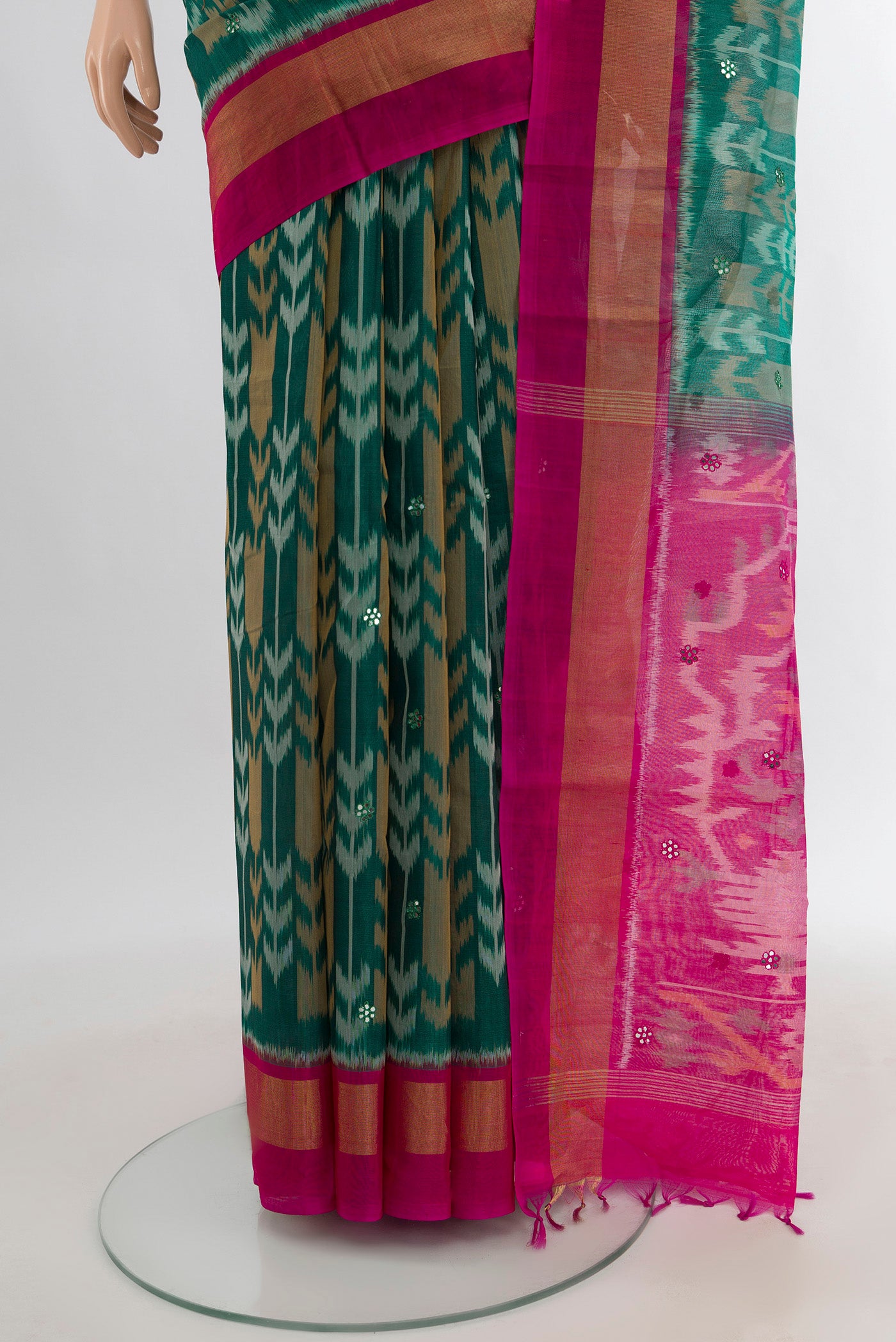 Pleats and pallu of Teal Silk Cotton Saree with Ikat Print on the body and Zari Border. 