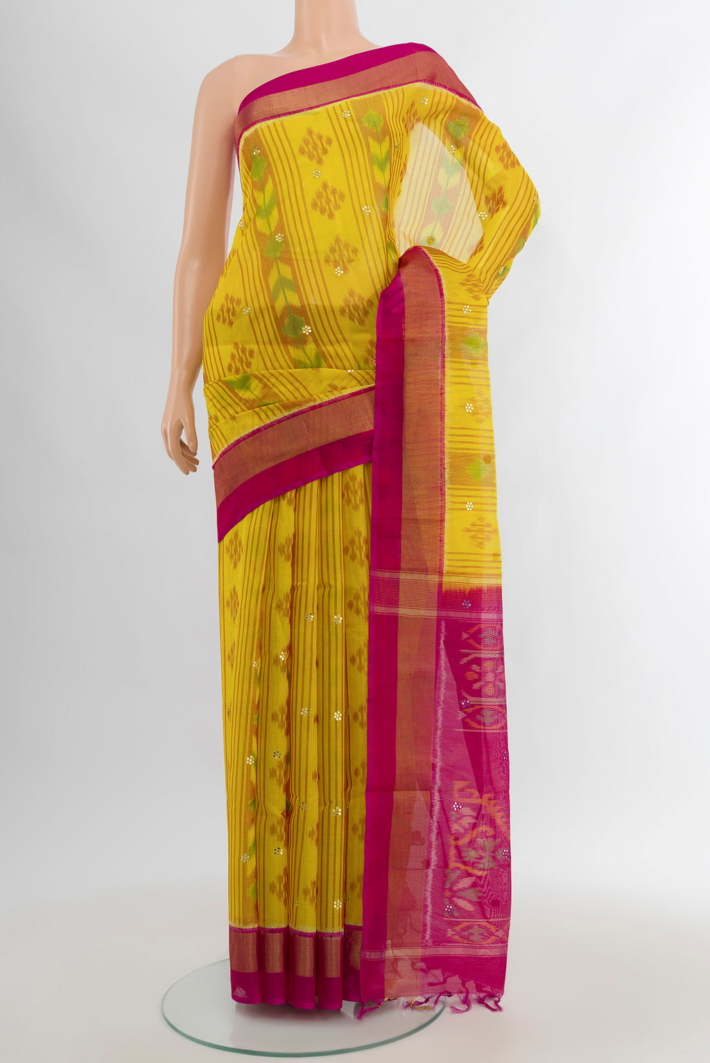 Yellow Silk Cotton Saree with Ikat Print on the body and Zari Border.  displayed on a mannequin