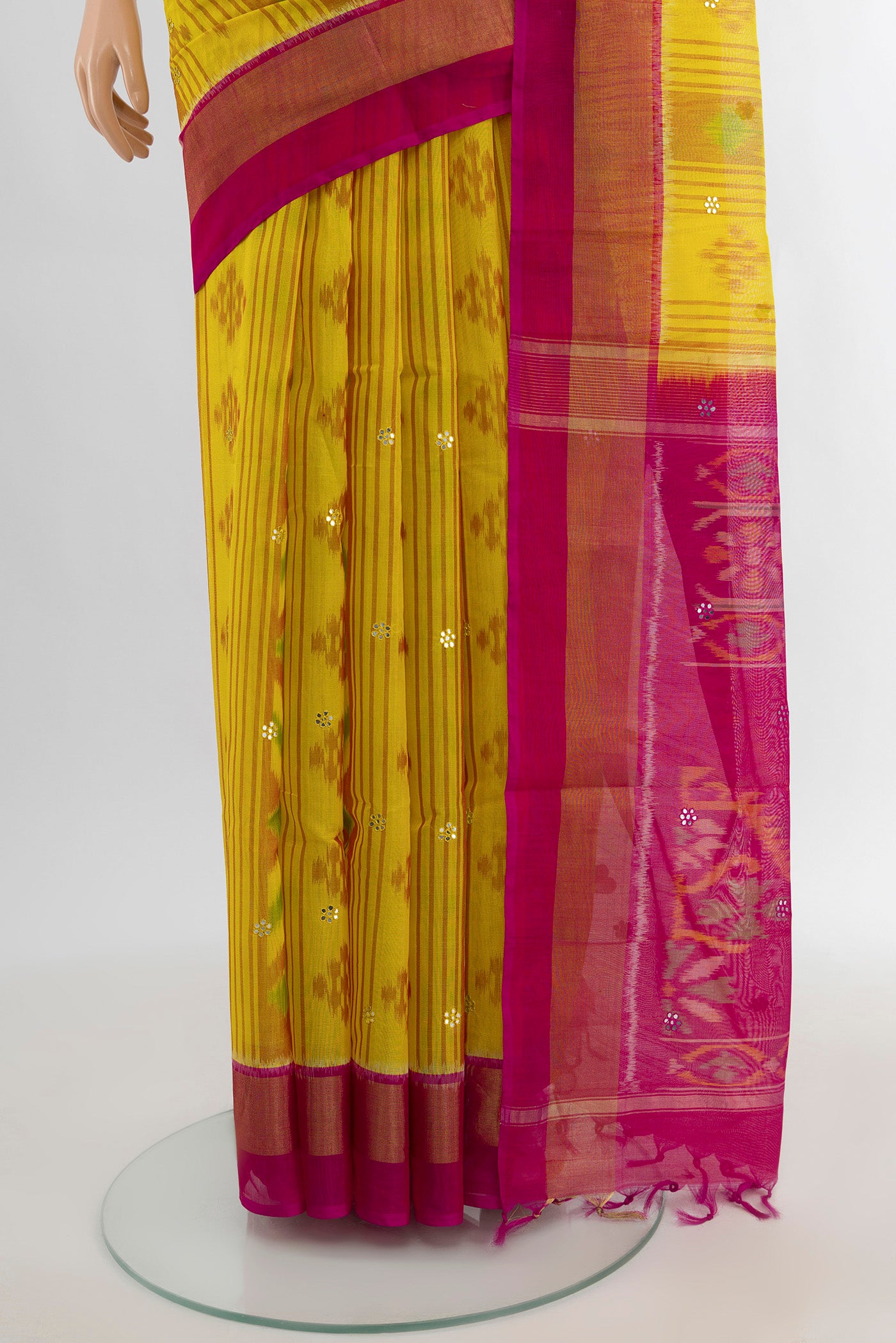 Pleats and pallu of Yellow Silk Cotton Saree with Ikat Print on the body and Zari Border. 