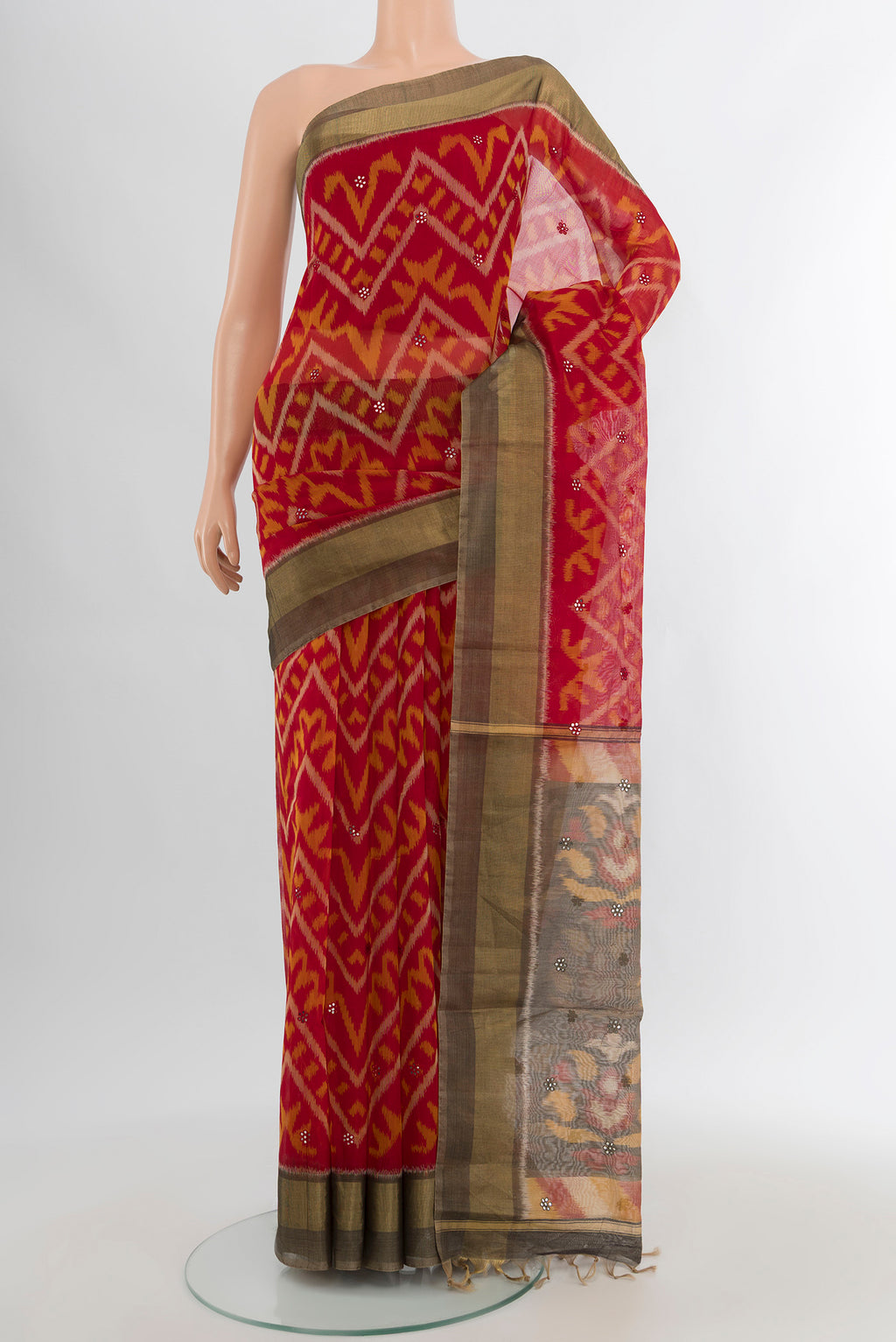 Red Silk Cotton Saree with Ikat design on the body and Zari Border.  displayed on a mannequin