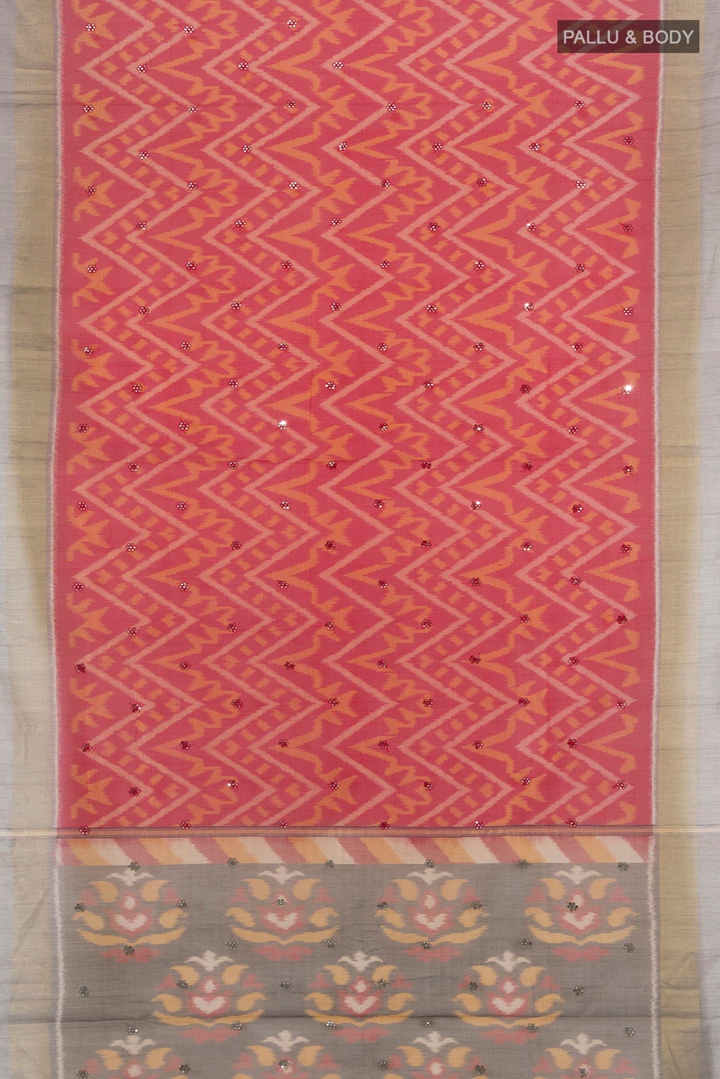 Flat view of Red Silk Cotton Saree with Ikat design on the body and Zari Border. 