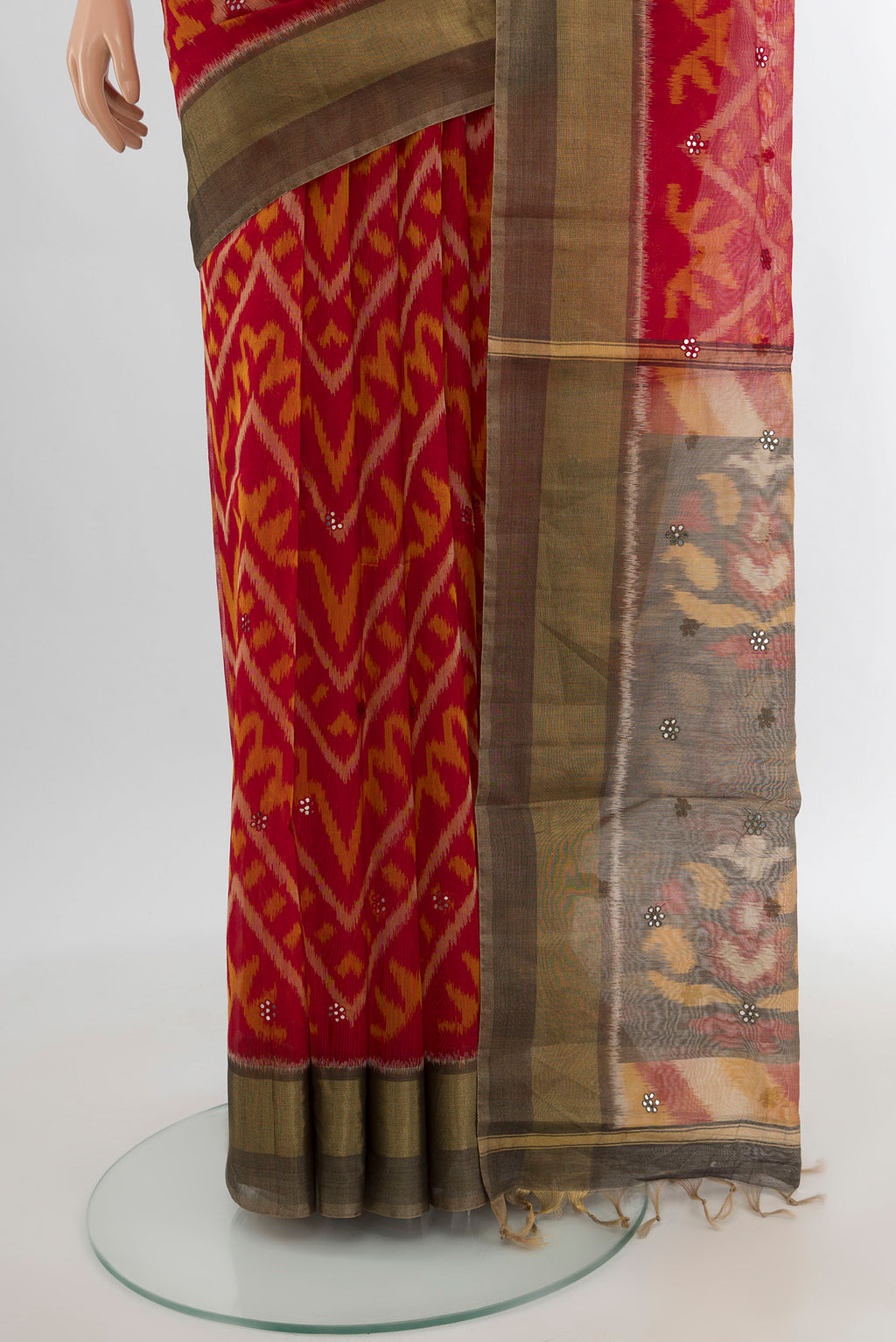 Pleats and pallu of Red Silk Cotton Saree with Ikat design on the body and Zari Border. 