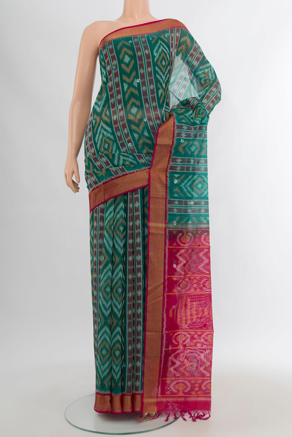Sea Green Silk Cotton Saree with Ikat design on the body and Zari Border.  displayed on a mannequin