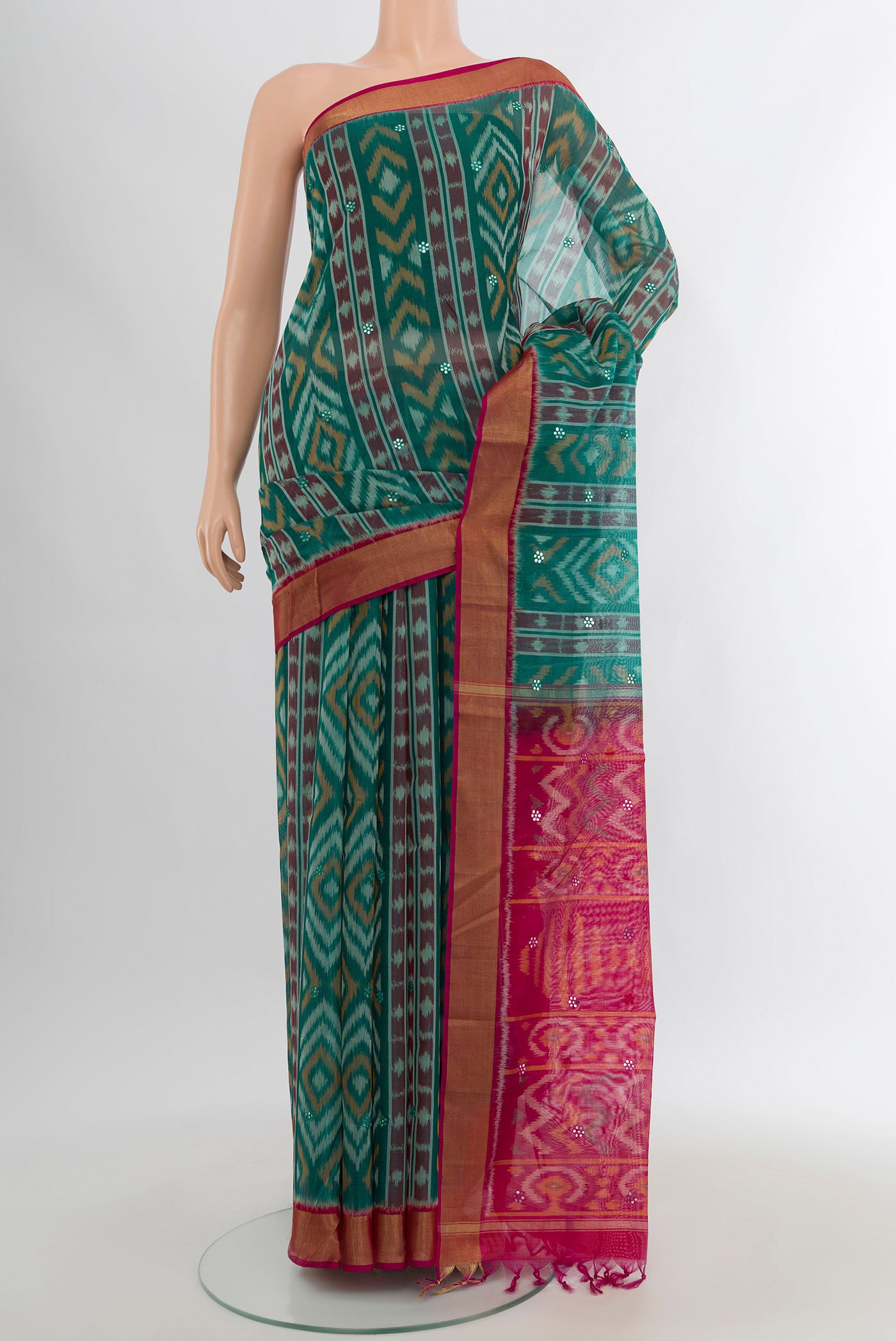Sea Green Silk Cotton Saree with Ikat design on the body and Zari Border.  displayed on a mannequin