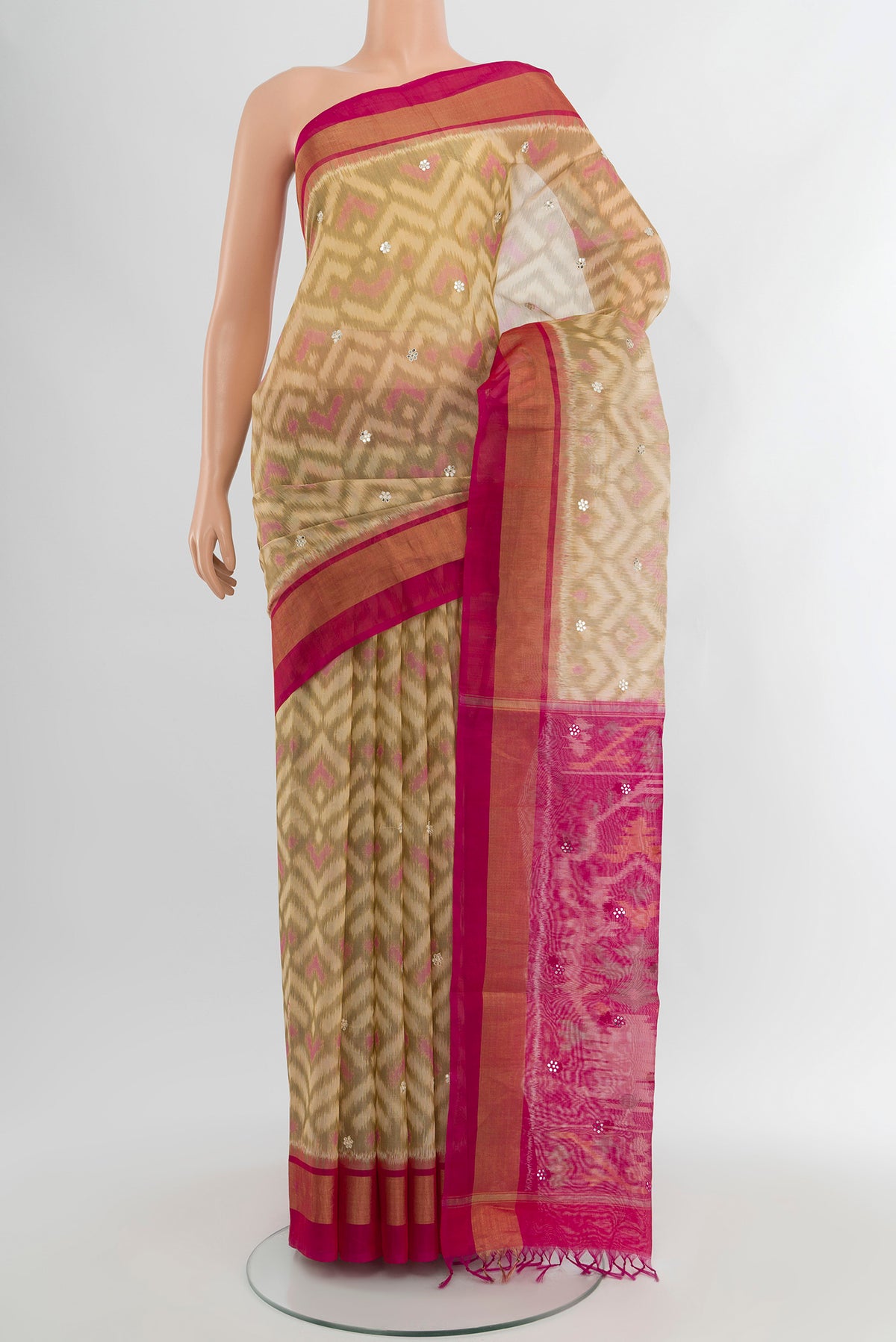Cream Silk Cotton Saree with Ikat Print on the body and Plain Border.  displayed on a mannequin