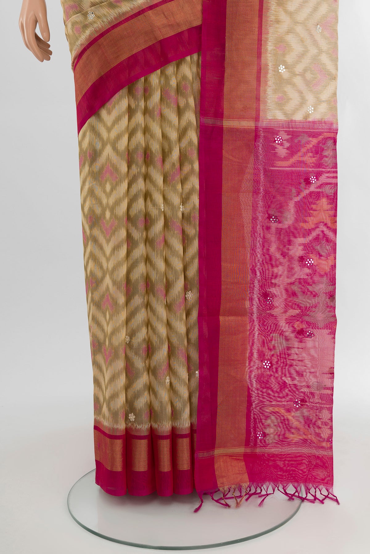 Pleats and pallu of Cream Silk Cotton Saree with Ikat Print on the body and Plain Border. 