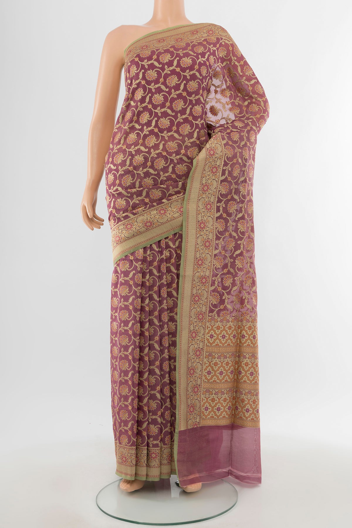 Bronze Banarasi Silk Saree with Zari Butta on the body and Silk Border.  displayed on a mannequin