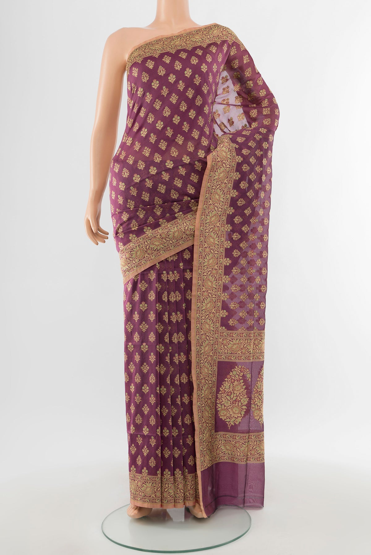 Bronze Banarasi Silk Saree with Zari Butta on the body and Silk Border.  displayed on a mannequin
