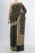 Black Banarasi Silk Saree with Zari Butta on the body and Zari Border.  displayed on a mannequin