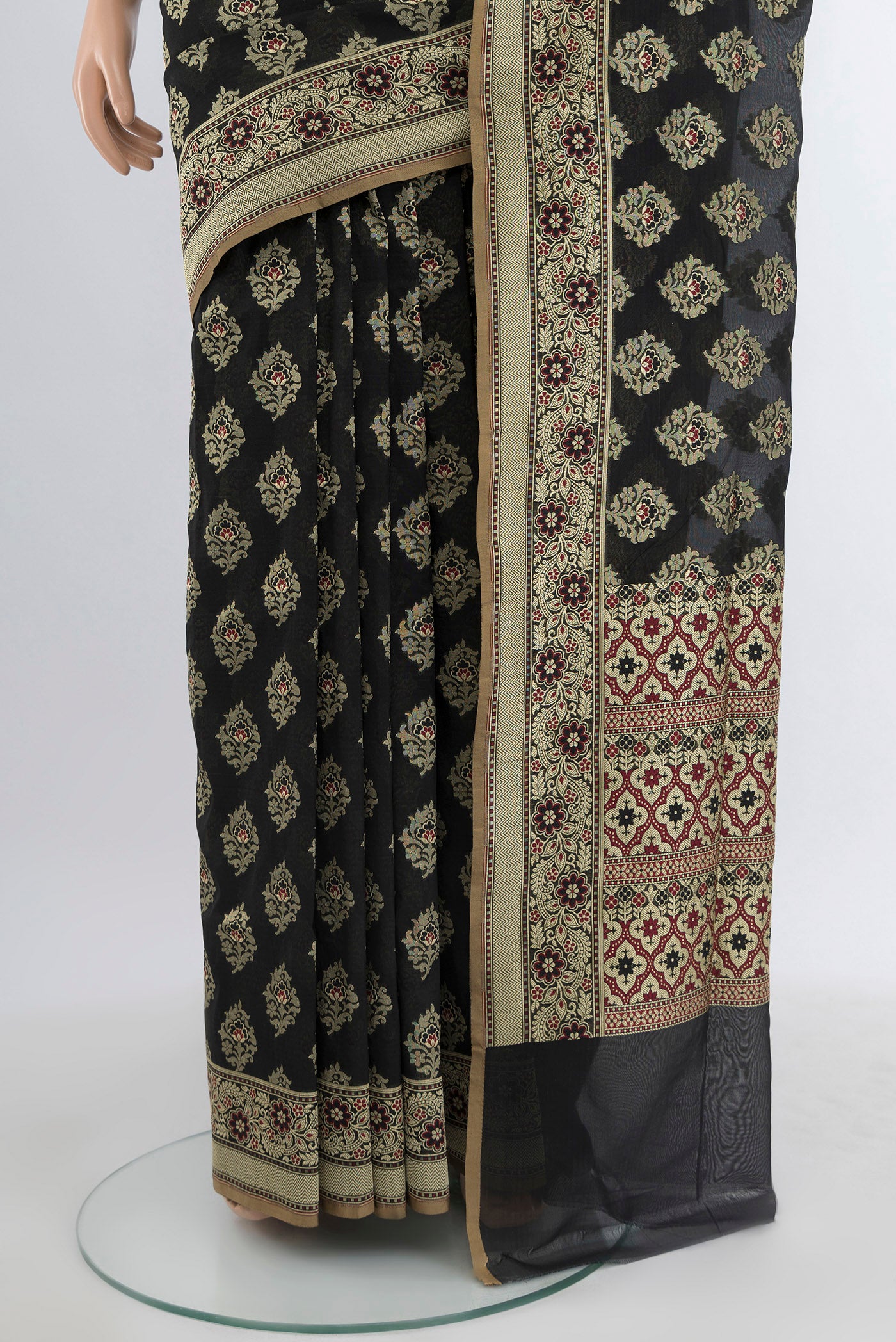 Pleats and pallu of Black Banarasi Silk Saree with Zari Butta on the body and Zari Border. 