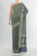 Grey Banarasi Silk Saree with Zari Butta on the body and Zari Border.  displayed on a mannequin