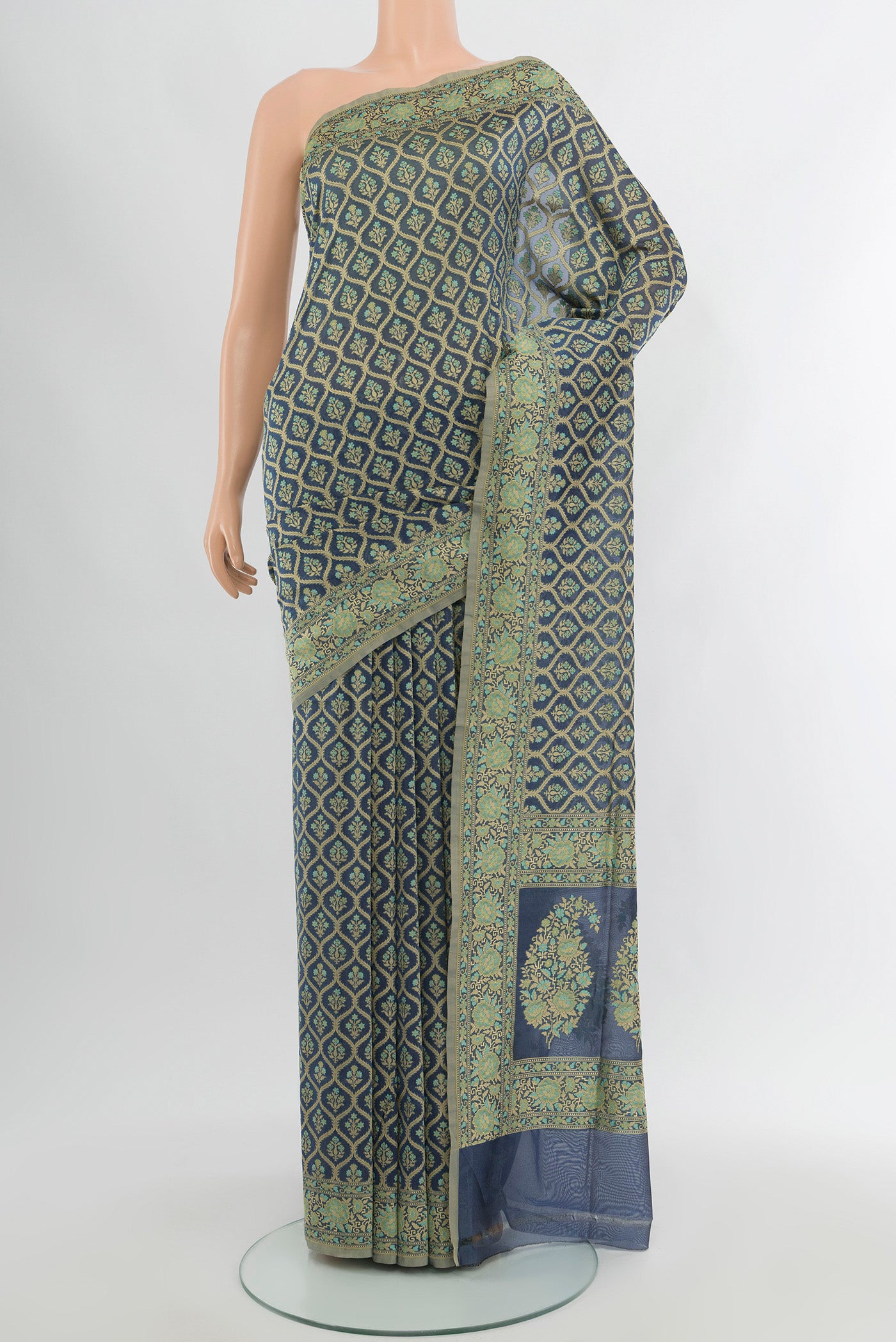 Grey Banarasi Silk Saree with Zari Butta on the body and Zari Border.  displayed on a mannequin