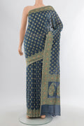 Davys Grey Banarasi Silk Saree with Zari Butta on the body and Zari Border.  displayed on a mannequin