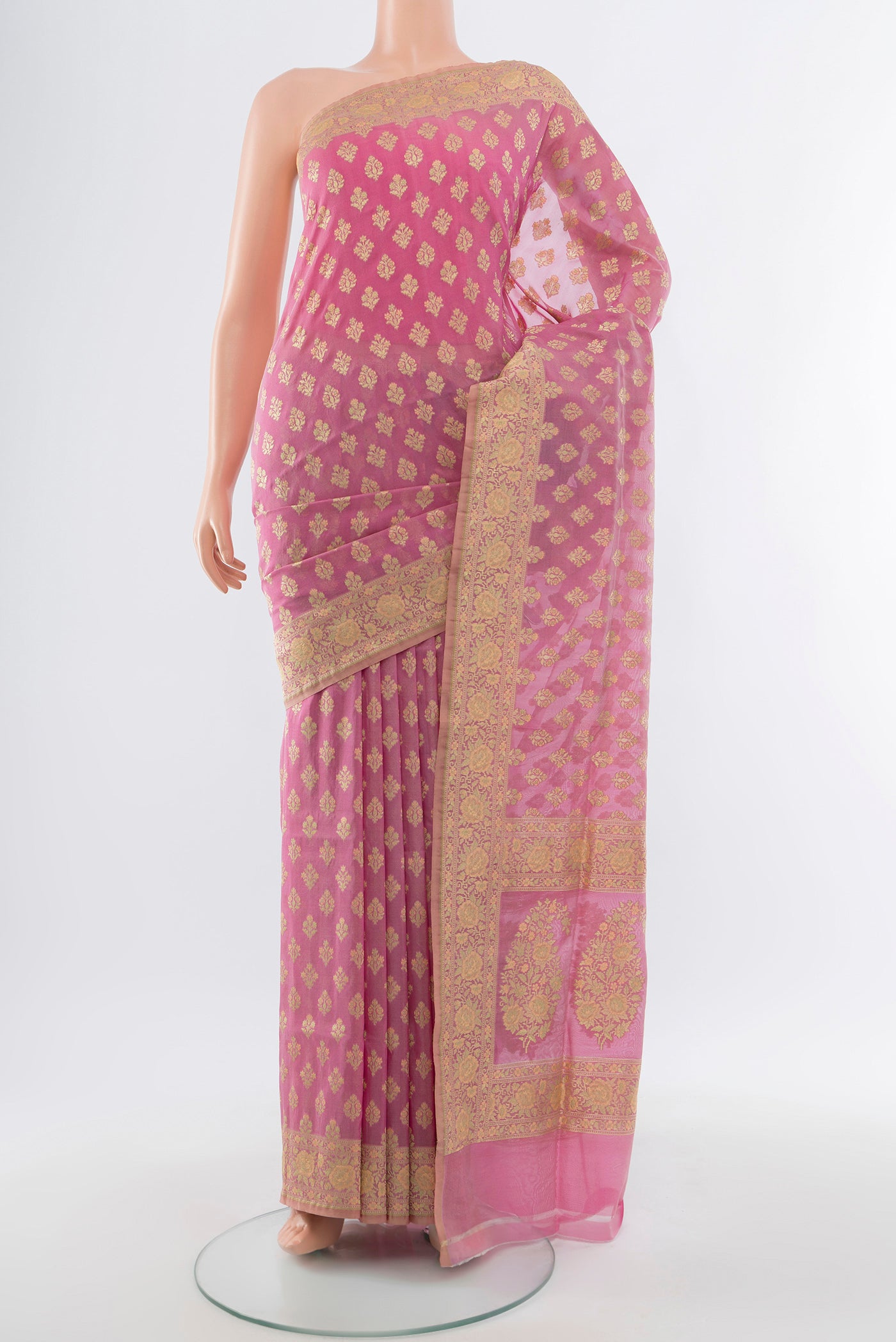Rose Gold Banarasi Silk Saree with Zari Butta on the body and Silk Border.  displayed on a mannequin