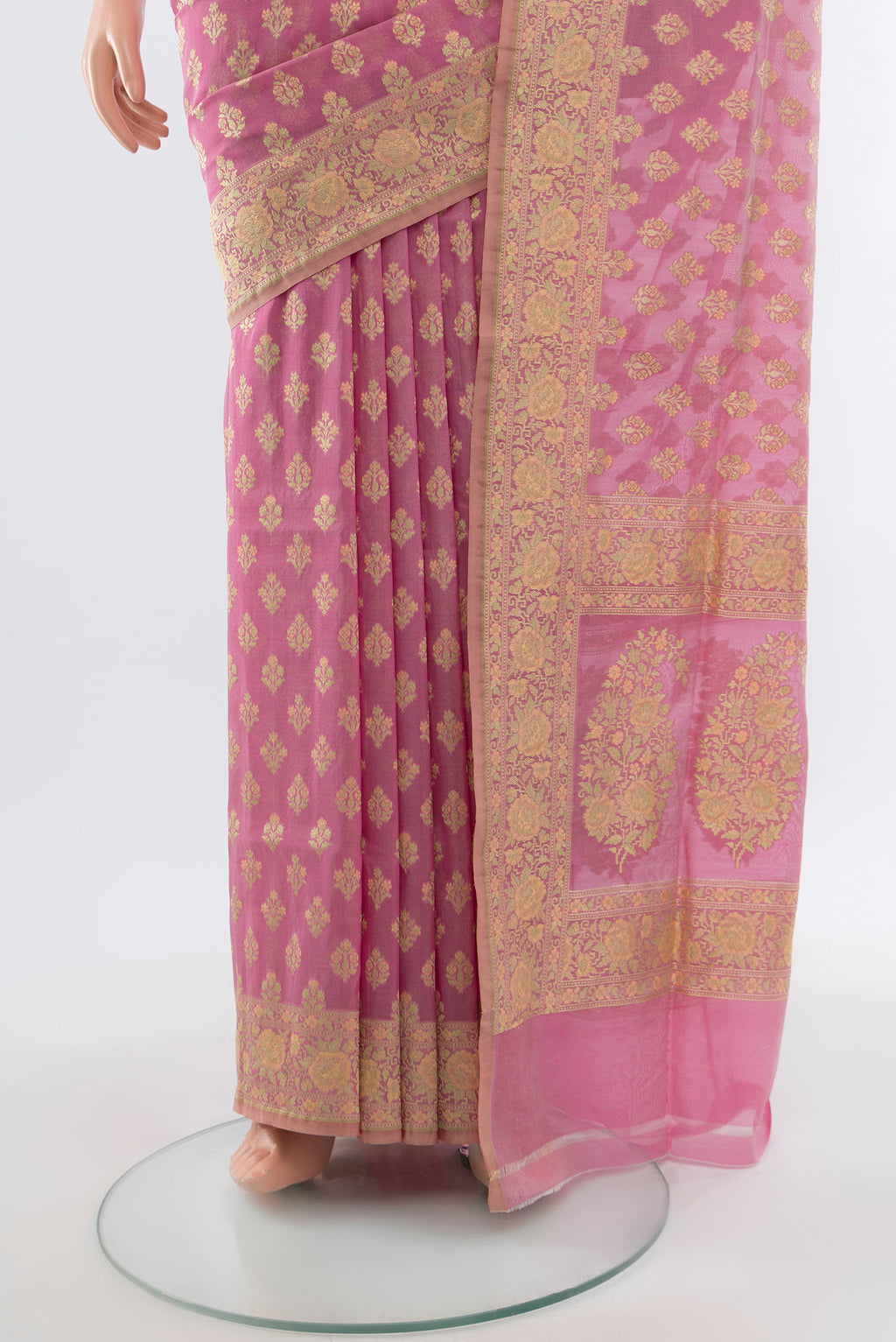 Pleats and pallu of Rose Gold Banarasi Silk Saree with Zari Butta on the body and Silk Border. 