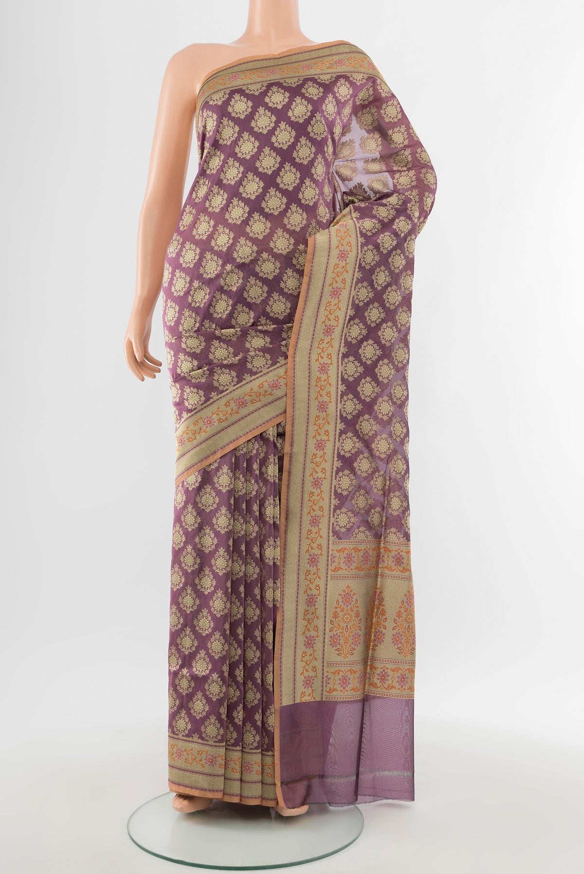 Bronze Banarasi Silk Saree with Zari Butta on the body and Silk Border.  displayed on a mannequin