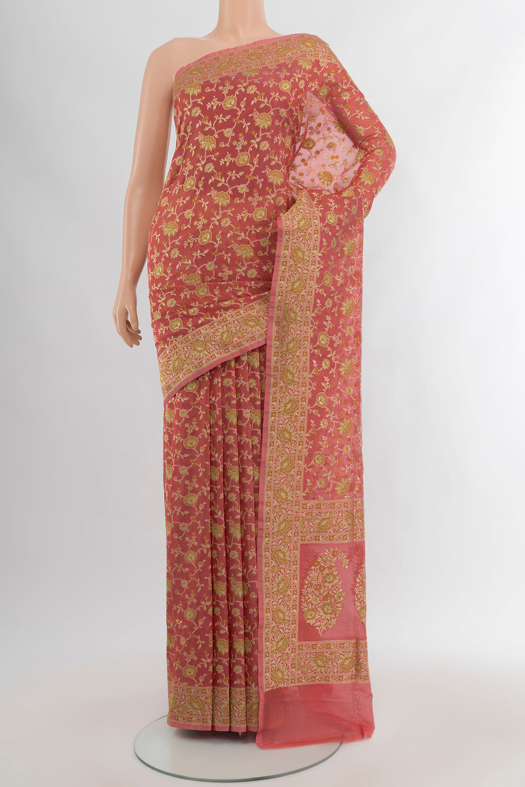 Peach Banarasi Silk Saree with Zari And Thread Butta on the body and Zari Border.  displayed on a mannequin