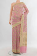 Pure Silk Rose pink Banarasi Saree with Zari Butta on the body and Zari Border.  displayed on a mannequin