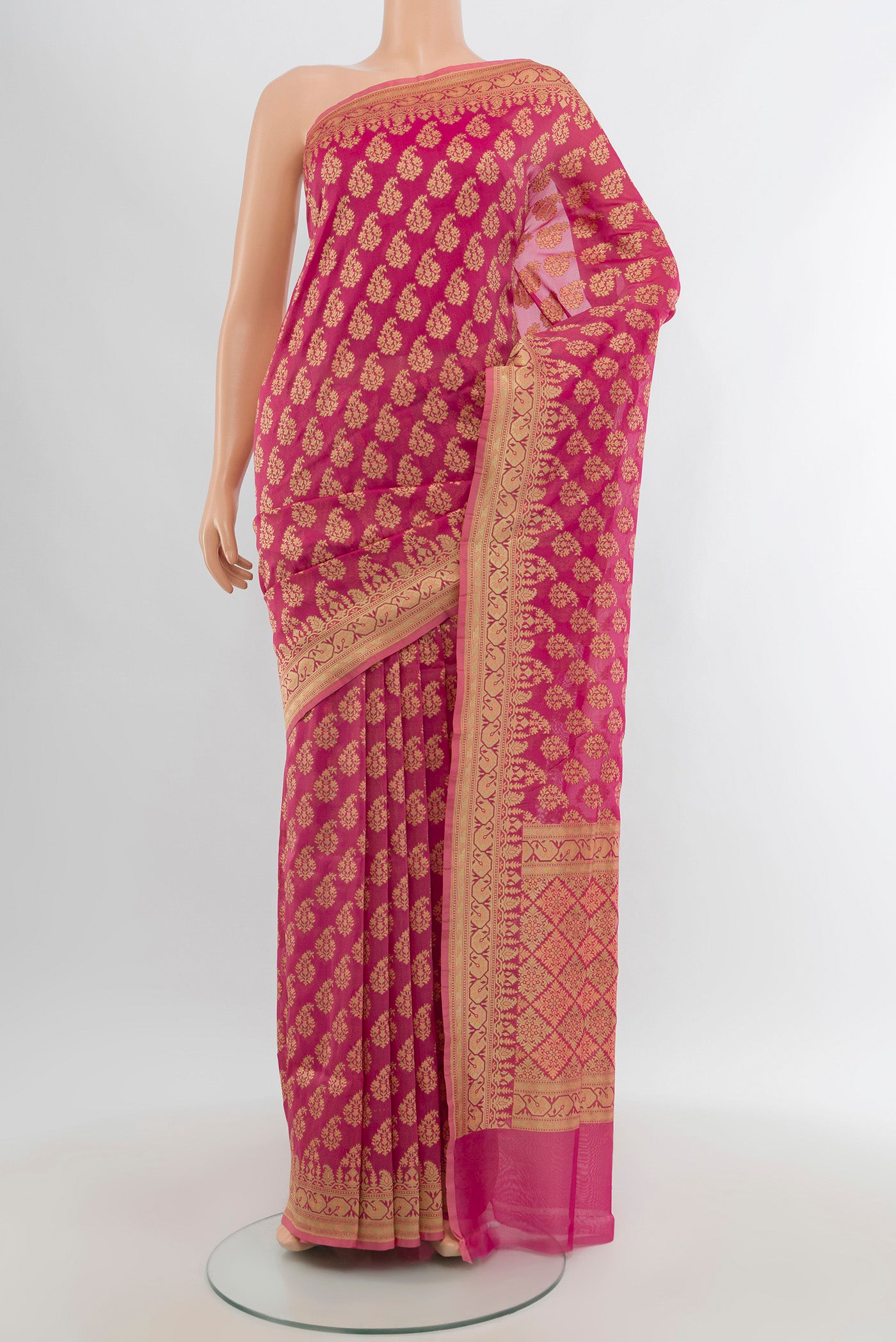 Pink Banarasi Silk Saree with Zari And Thread Butta on the body and Zari Border.  displayed on a mannequin