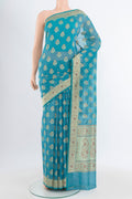 Light Blue Banarasi Silk Saree with Zari And Thread Butta on the body and Zari Border.  displayed on a mannequin