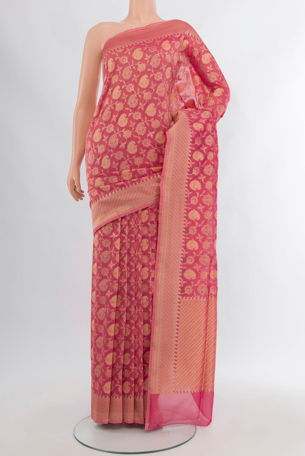 Rose pink Banarasi Silk Saree with Zari And Thread Butta on the body and Zari Border.  displayed on a mannequin