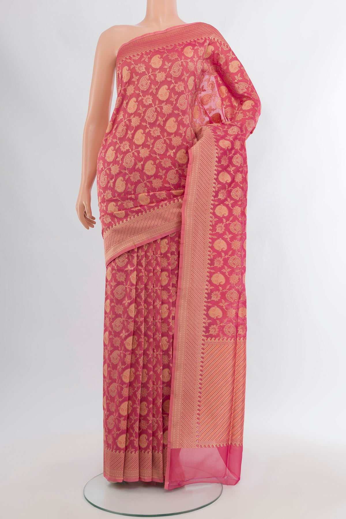 Rose pink Banarasi Silk Saree with Zari And Thread Butta on the body and Zari Border.  displayed on a mannequin