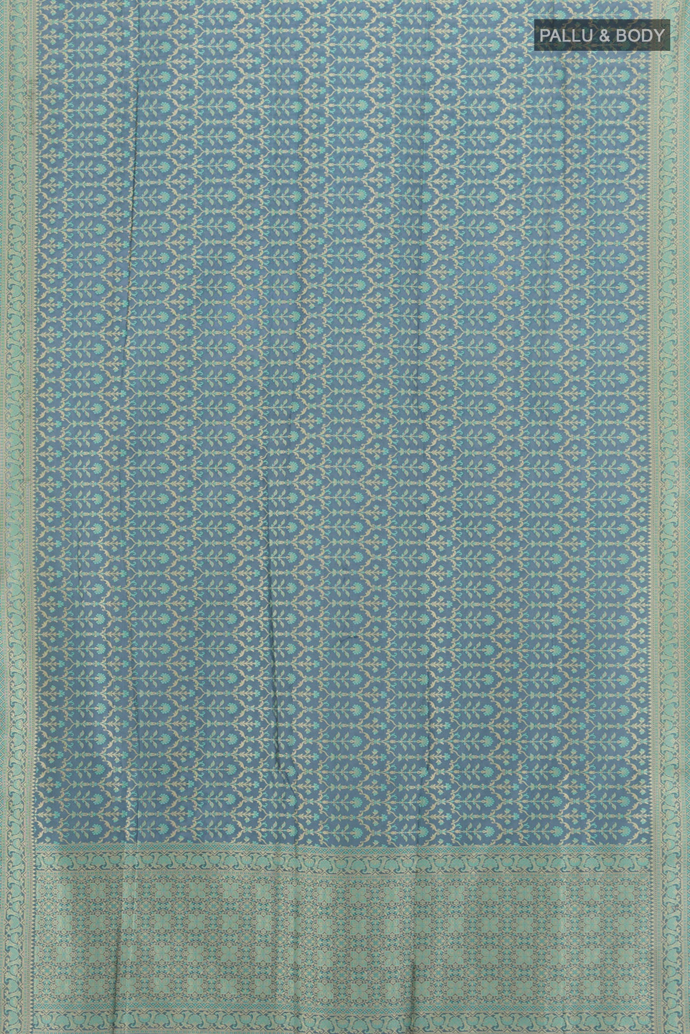 Flat view of Davys Grey Banarasi Silk Saree with Zari And Thread Butta on the body and Zari Border. 