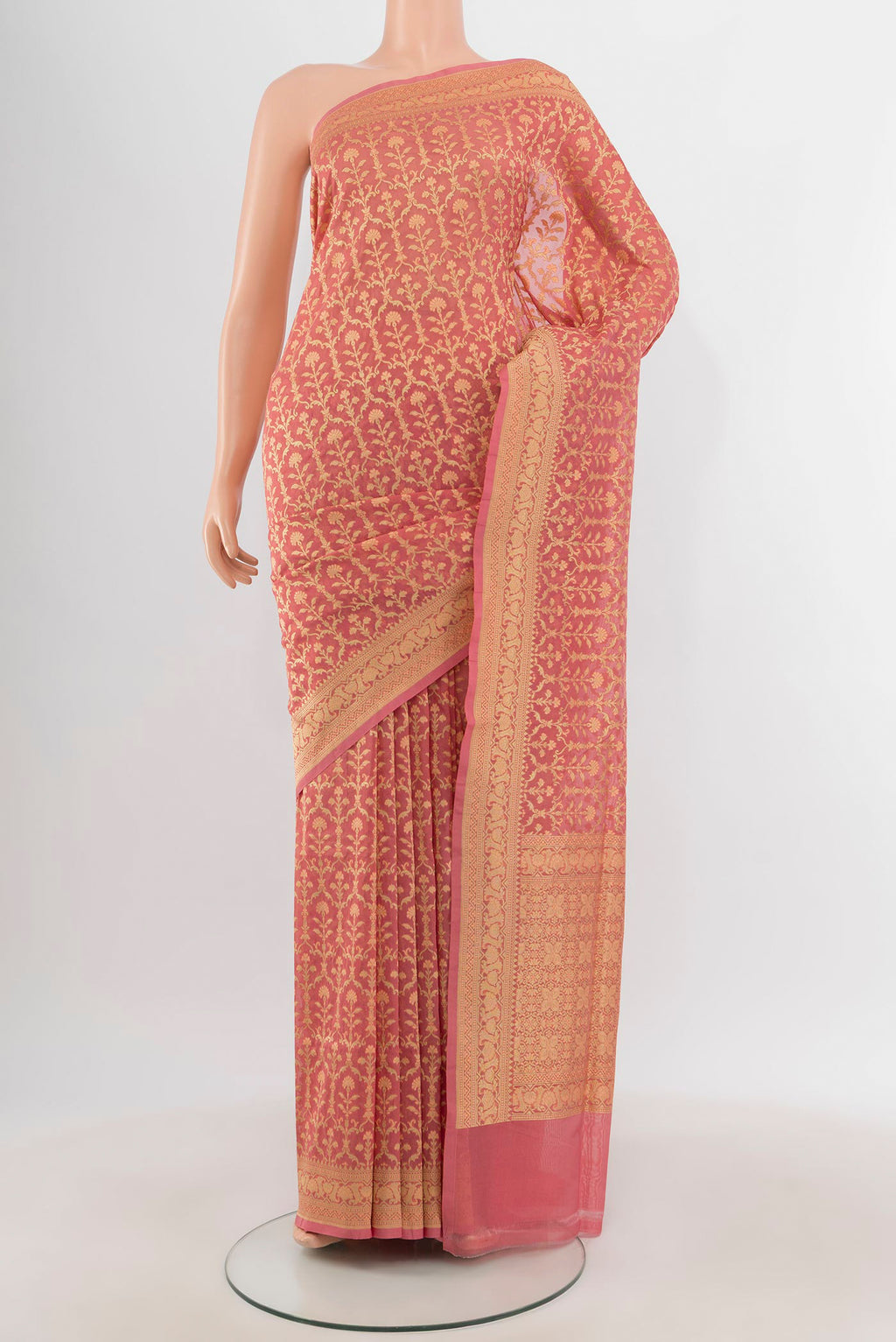 Peach Banarasi Silk Saree with Zari And Thread Butta on the body and Zari Border.  displayed on a mannequin